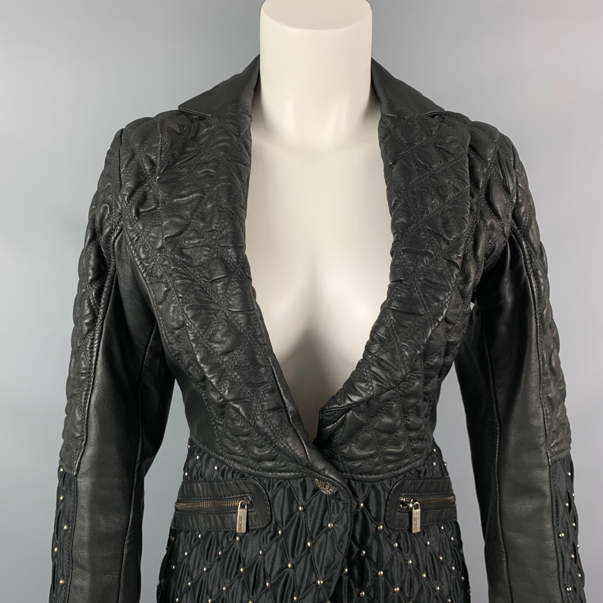 JUST CAVALLI jacket comes in a black quilted acetate / viscose with a full liner featuring a shawl collar, studded details, a-line, zipper pockets, and a single button closure. 

Very Good Pre-Owned Condition.
Marked: 40
Original Retail Price: