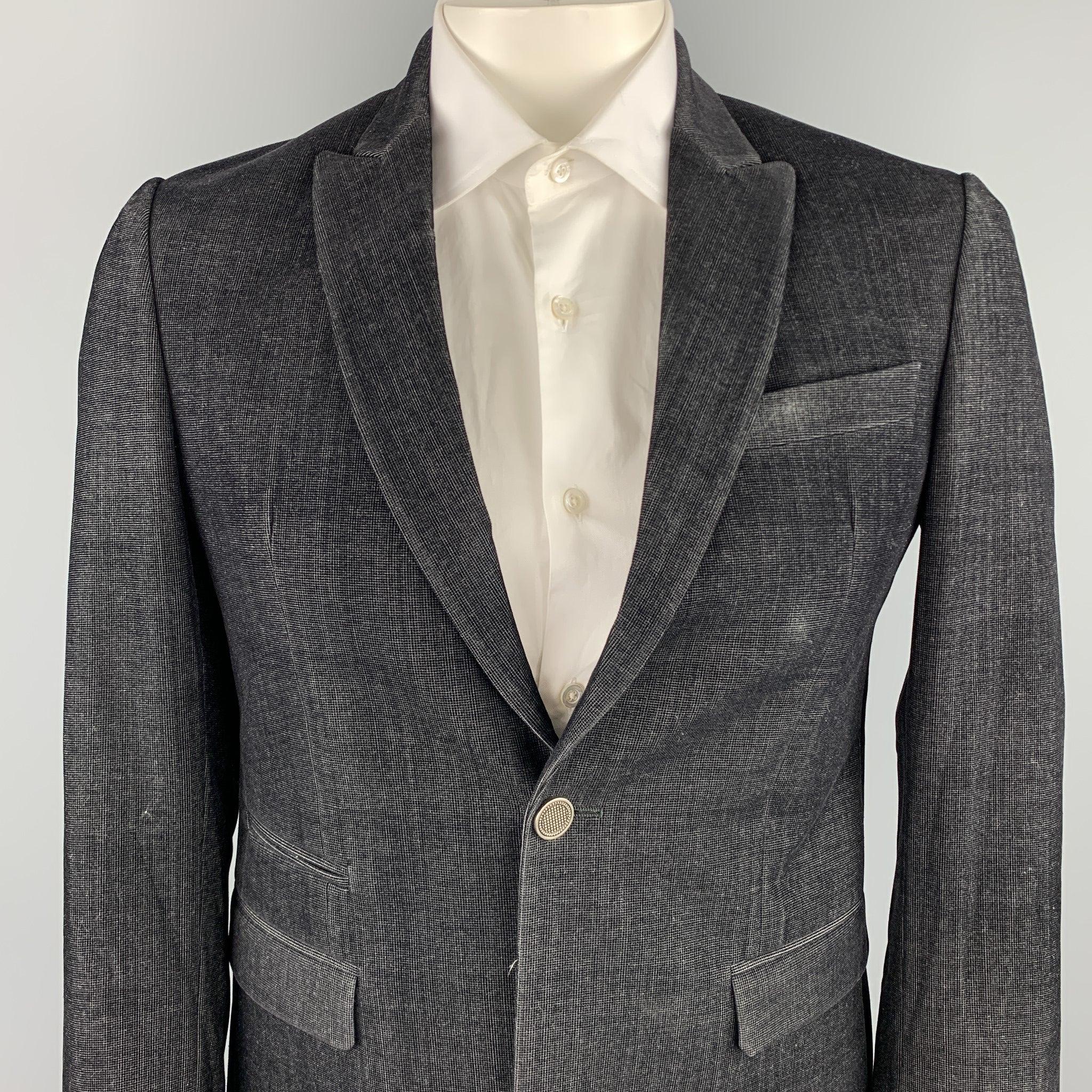 JUST CAVALLI sport coat comes in a black textured polyester blend with a full monogram liner featuring a peak lapel, flap pockets, and a single button closure. Made in Italy.Excellent
Pre-Owned Condition. 

Marked:   IT 50 

Measurements: 
