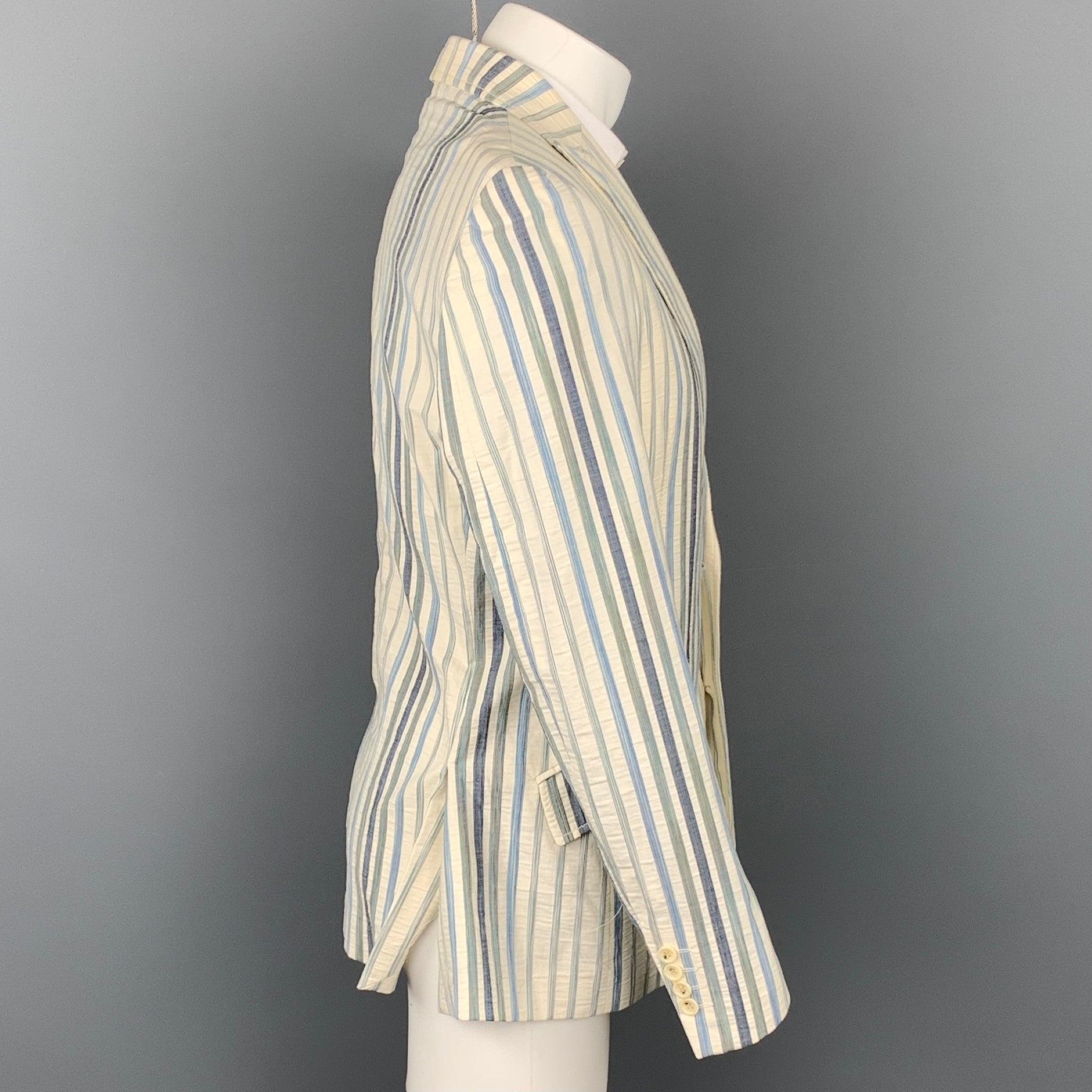 JUST CAVALLI sport coat comes in a cream & blue stripe cotton blend with a snake skin print half liner featuring a peak lapel, flap pockets, and a two button closure. Made in Italy.Very Good
 Pre-Owned Condition. 
 

 Marked:  IT 50 
 


