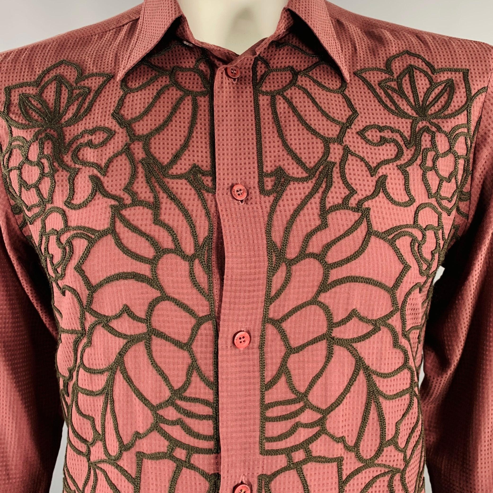 JUST CAVALLI long sleeve shirt
in a burgundy cotton silk fabric featuring a squares background pattern, black floral embroidered front, and button closure. Made in Italy.Excellent Pre-Owned Condition. 

Marked:   IT 52 

Measurements: 
 
Shoulder: