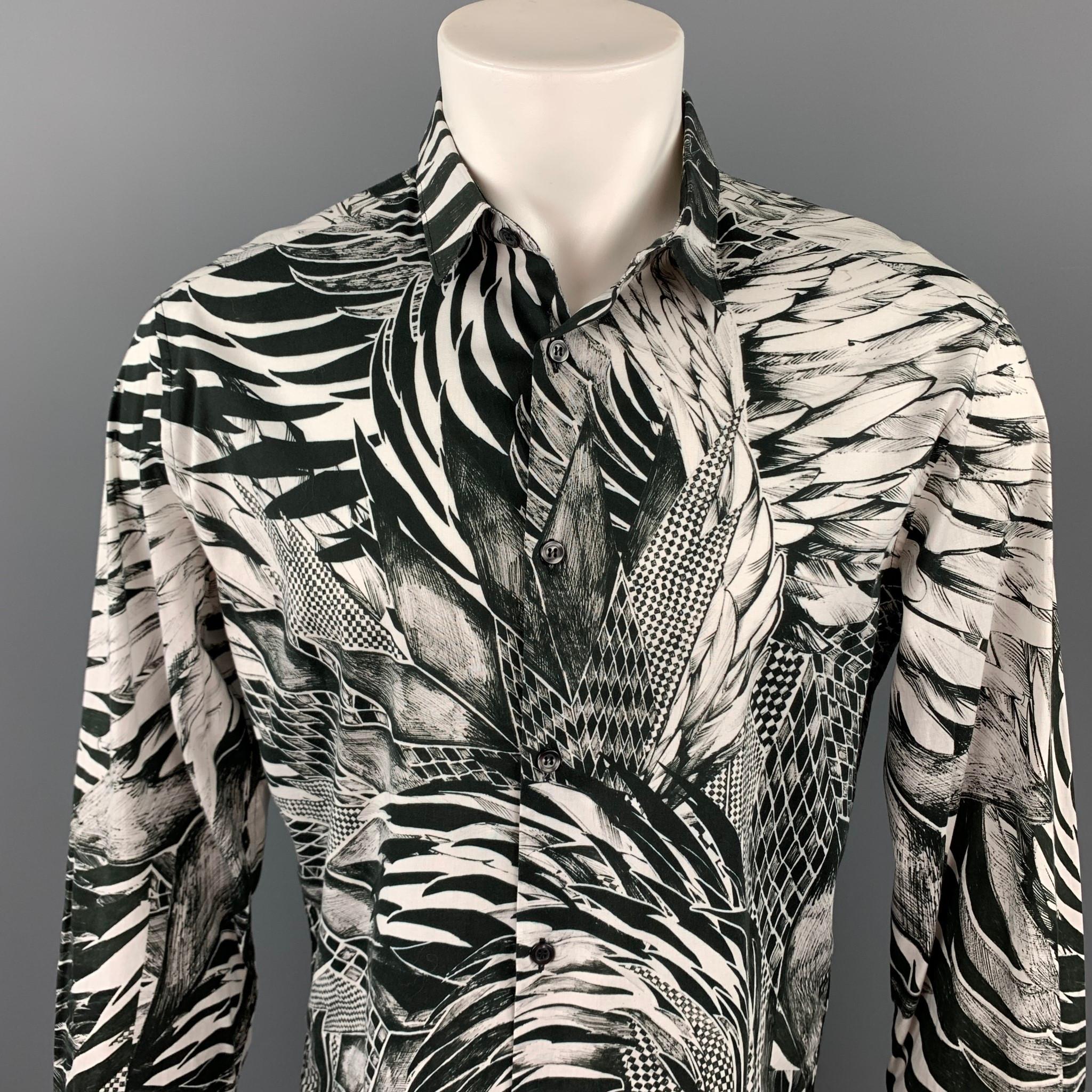 JUST CAVALLI long sleeve shirt comes in a black & white abstract print cotton featuring a button up style and a spread collar. Made in Romania.

Very Good Pre-Owned Condition.
Marked: 50

Measurements:

Shoulder: 19 in.
Chest: 44 in.
Sleeve: 27