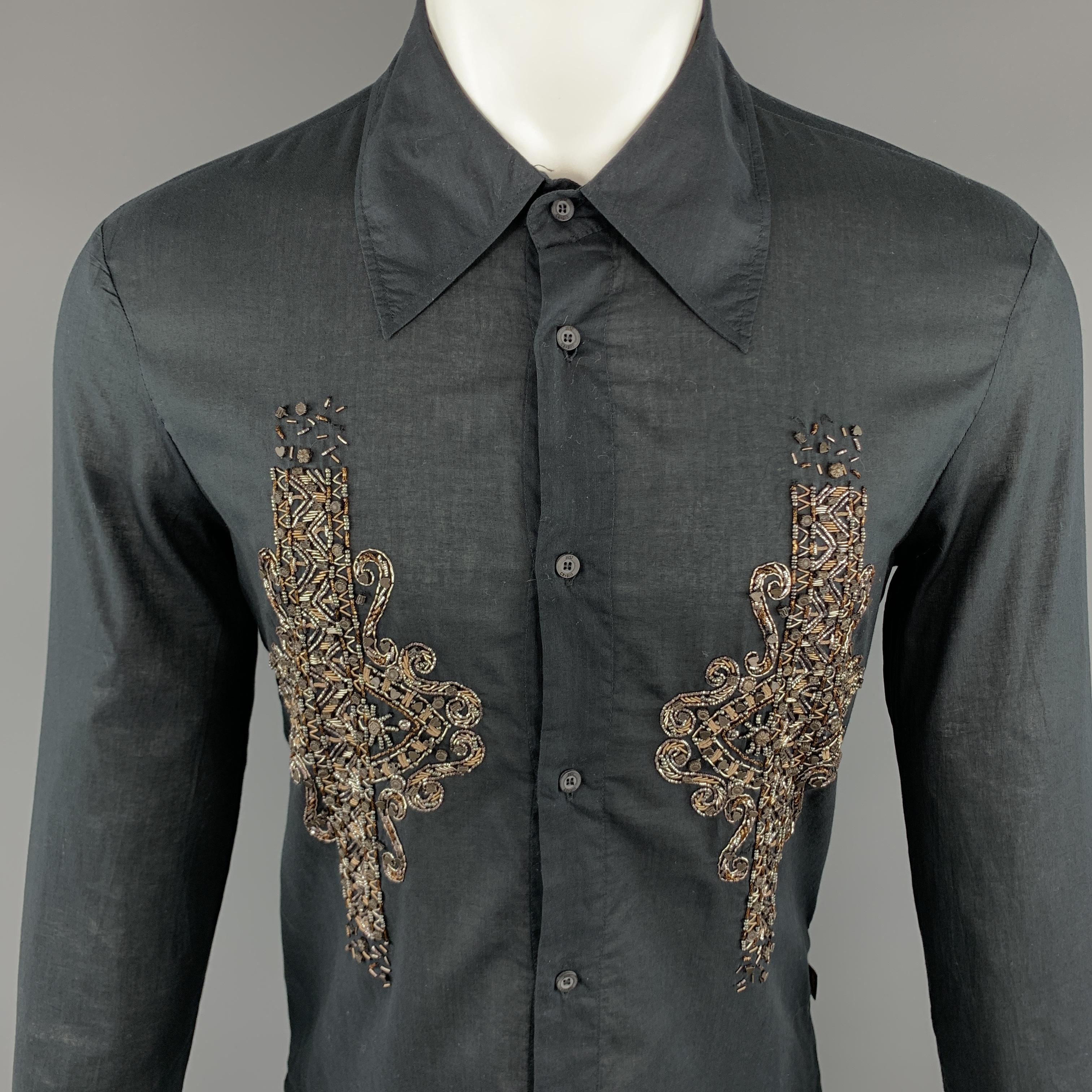 JUST CAVALLI  Long Sleeve Shirt comes in a black tone in a solid cotton material, with a pointed collar, embellishment at front, double buttoned cuffs, button up. Made in Italy.

Excellent Pre-Owned Condition.
Marked: IT 50

Measurements:

Shoulder: