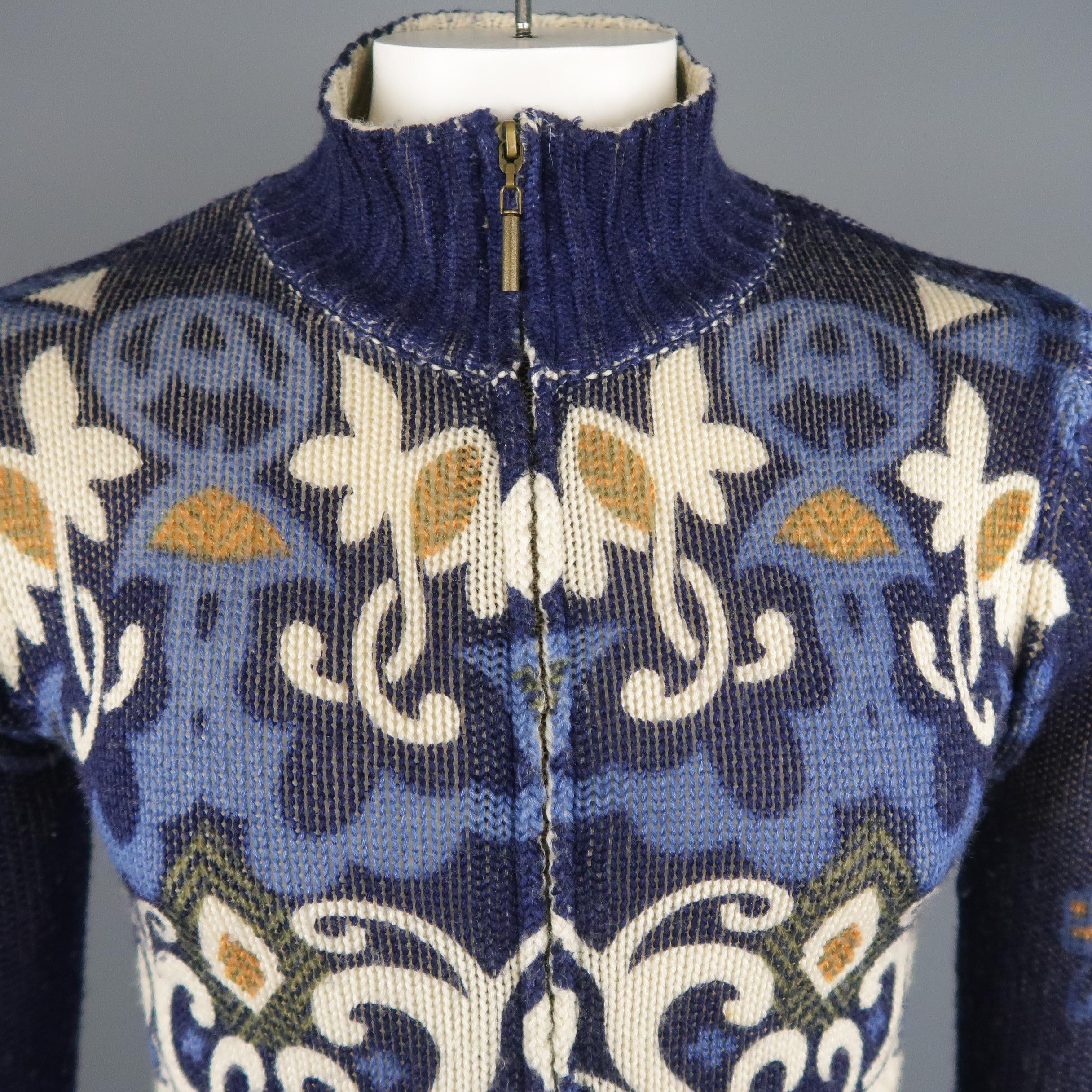 JUST CAVALLI Cardigan Sweater comes in a navy tone in a printed knit wool material, with a high collar, ribbed cuffs and hem, zip up. Made in Italy.  
 
Excellent Pre-Owned Condition.
Marked: M
 
Measurements:
 
Shoulder: 16.5 in.
Chest: 37