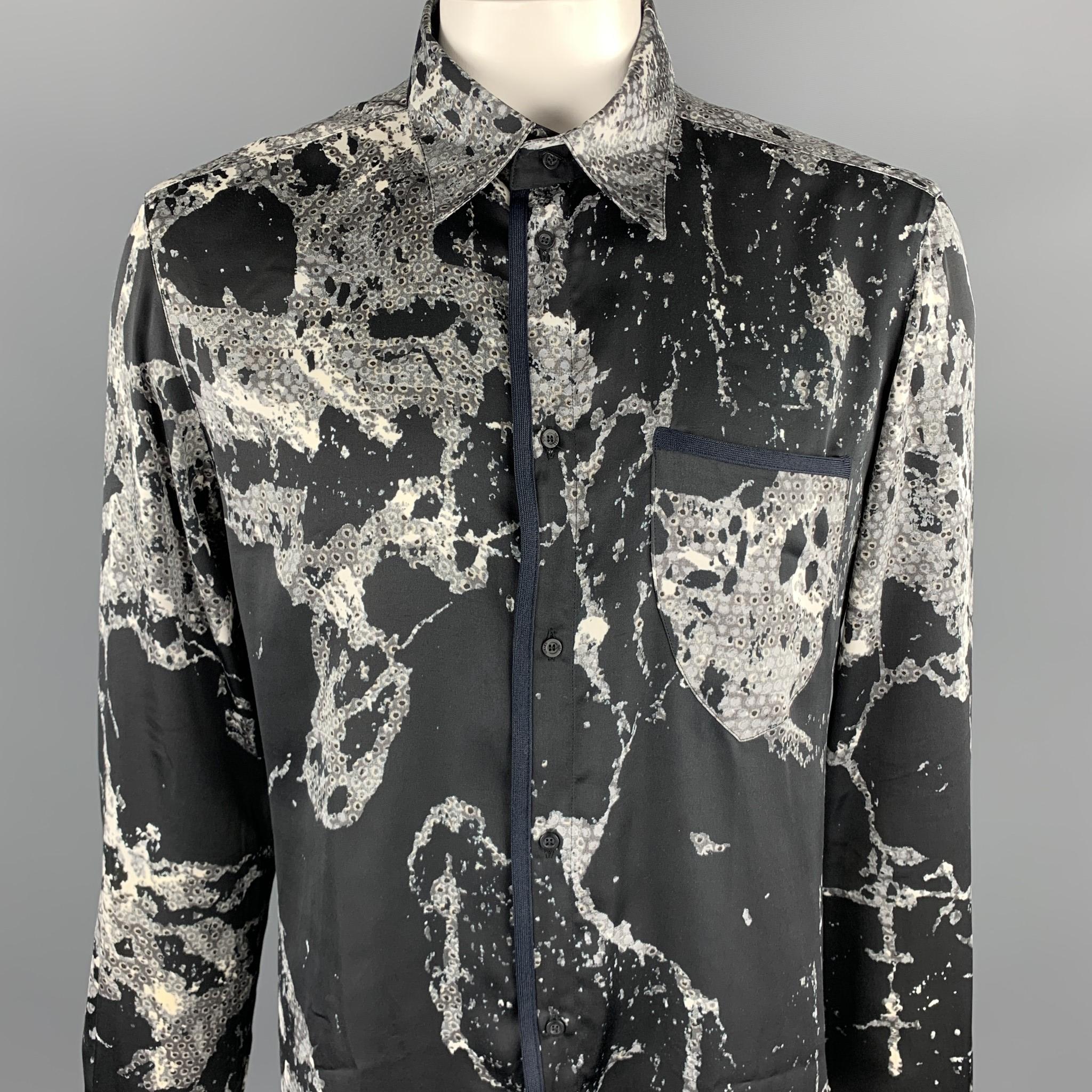 JUST CAVALLI long sleeve shirt comes in a black & gray print polyester featuring a button up style, patch pocket, and a spread collar. Made in Italy.

Excellent Pre-Owned Condition.
Marked: IT 56

Measurements:

Shoulder: 18 in.
Chest: 46 in.