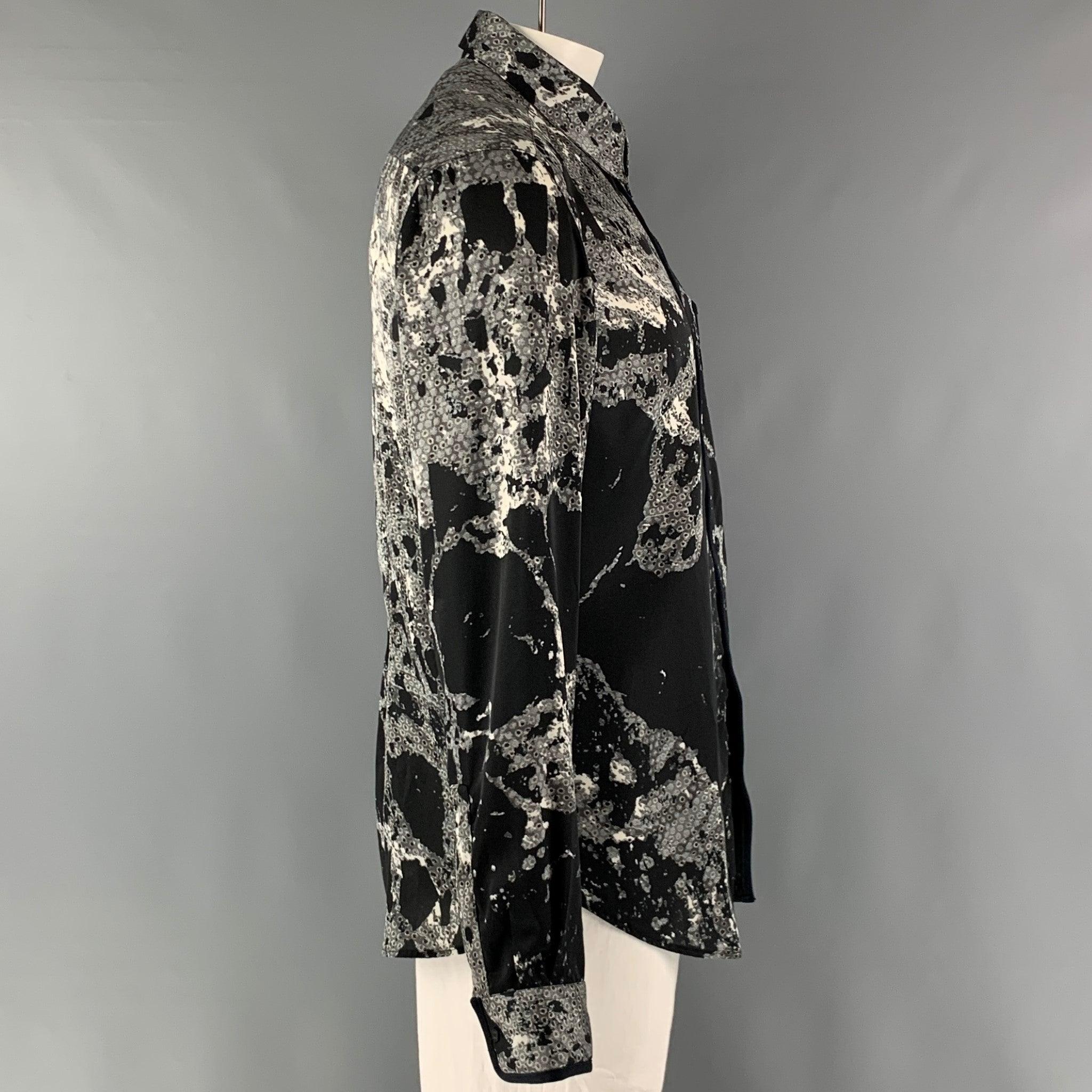 JUST CAVALLI long sleeve shirt comes in black and white abstract print polyester woven material featuring a button up style, front pocket, and a straight collar. Made in Italy.Excellent Pre-Owned Condition. 

Marked:   56 

Measurements: 
