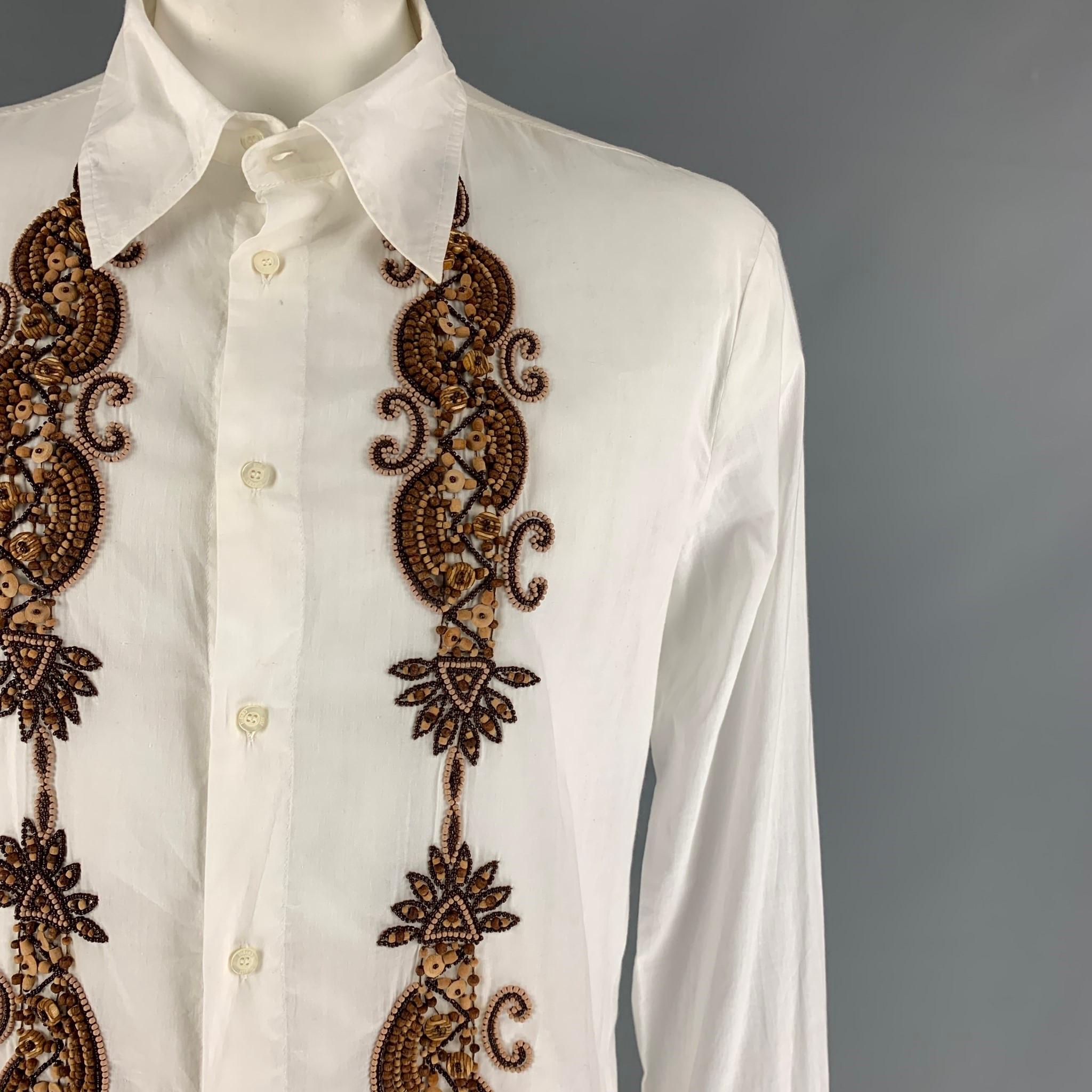 JUST CAVALLI long sleeve shit comers in a white cotton with brown beaded details featuring a spread collar and a buttoned closure. Made in Italy. 

Very Good Pre-Owned Condition.
Marked: 54

Measurements:

Shoulder: 19 in.
Chest: 44 in.
Sleeve: 30