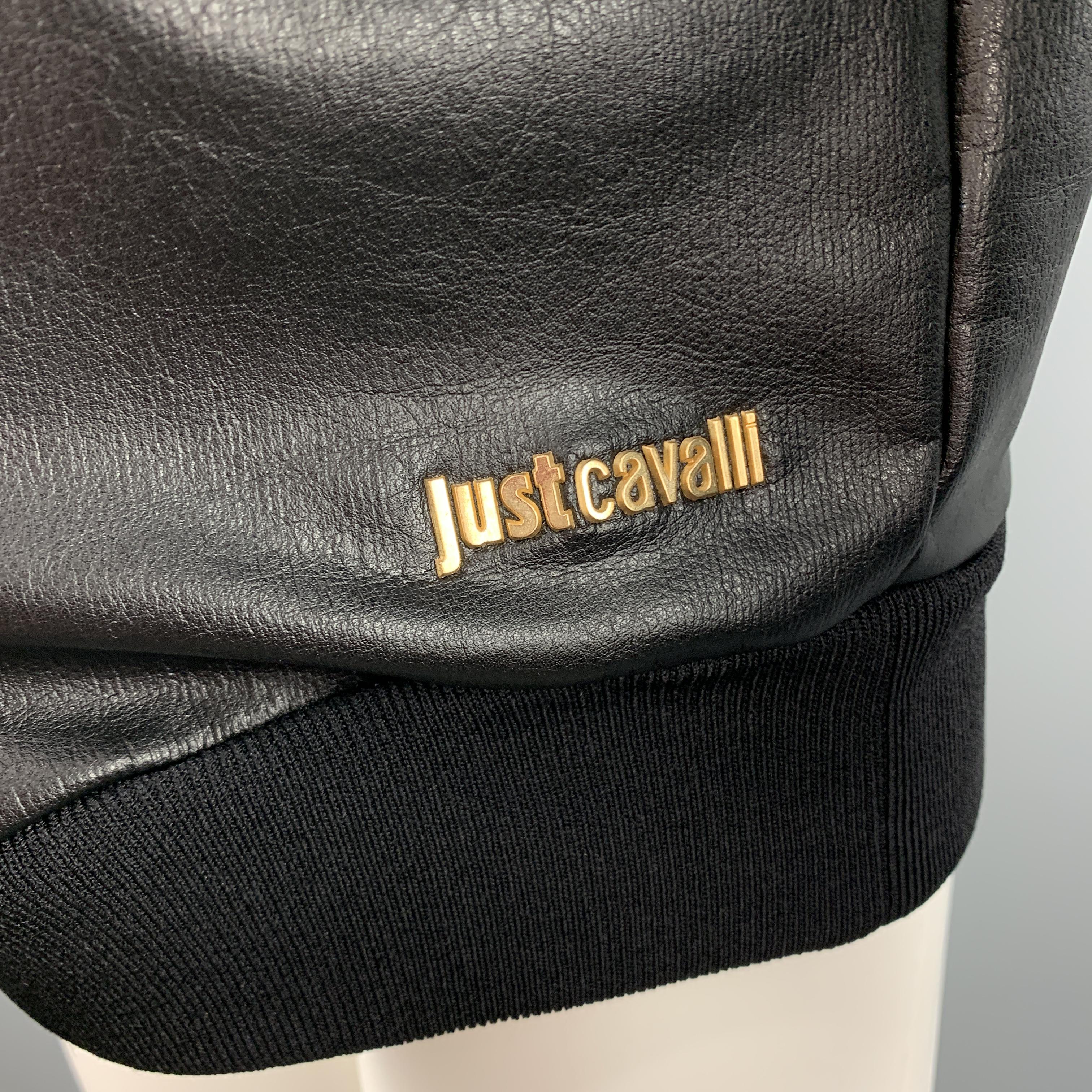 JUST CAVALLI western pullover comes in black coated leather effect cotton jersey with a ribbed crew neck and gold tone black and clear rhinestone studded shoulders. Made in Italy.

Excellent Pre-Owned Condition.
Marked: IT