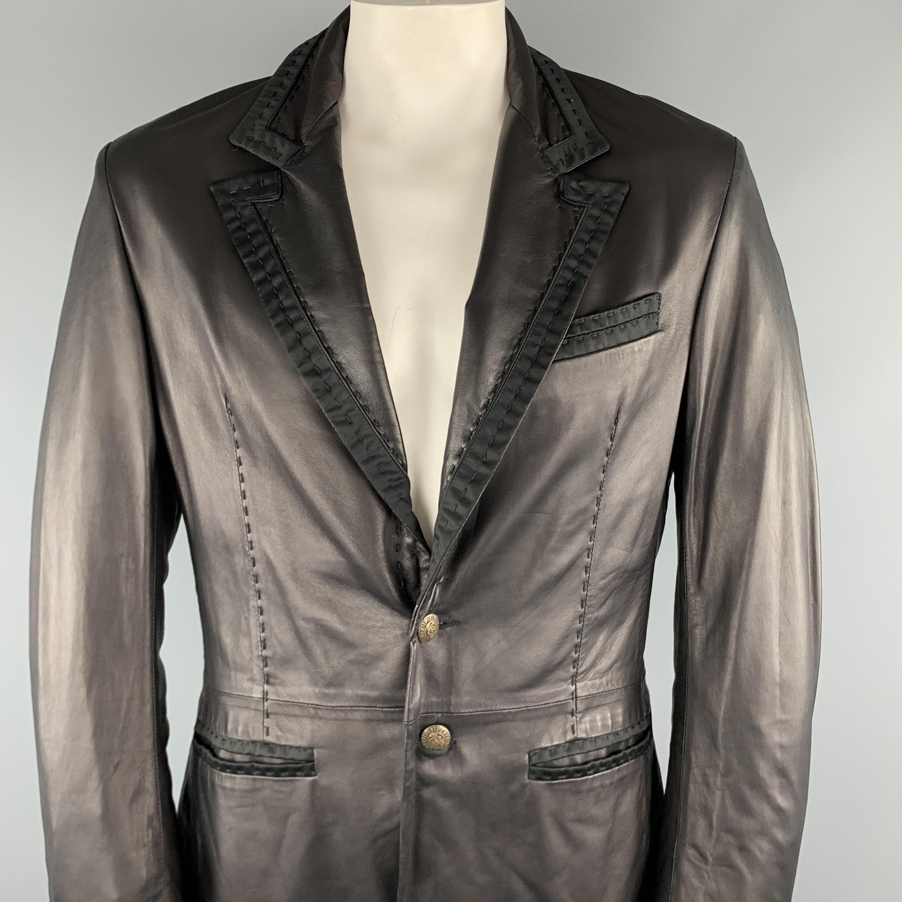 JUST CAVALLI Jacket comes in a black leather featuring a peak lapel style, black trim detail, slit pockets, and a two button closure. Made in Romania.

Excellent Pre-Owned Condition.
Marked: XXL

Measurements:

Shoulder: 18 in. 
Chest: 44