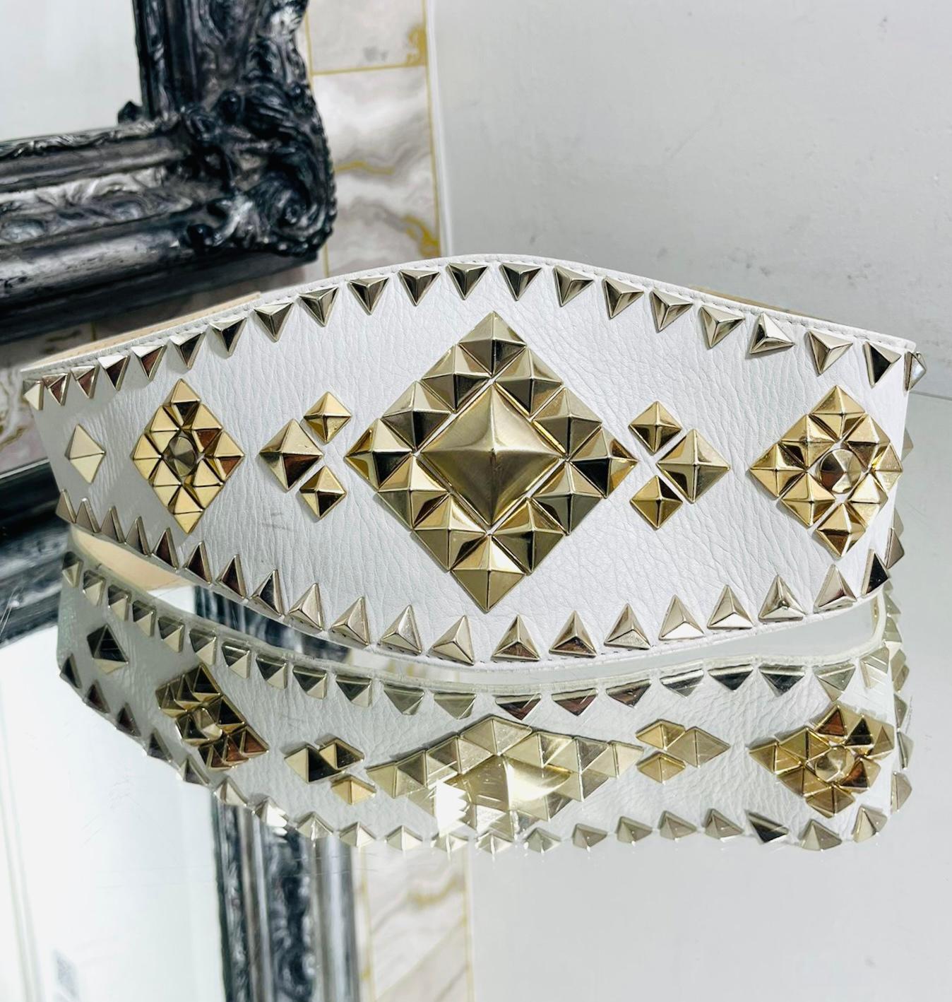 Just Cavalli Stud Embellished Leather Belt

White, wide belt designed with gold pyramid stud adornment to the front.

Detailed with gold 'Just Cavalli' logo engraved plaque to rear.

Featuring quadruple snap button closure.

Size – 87cm

Condition –