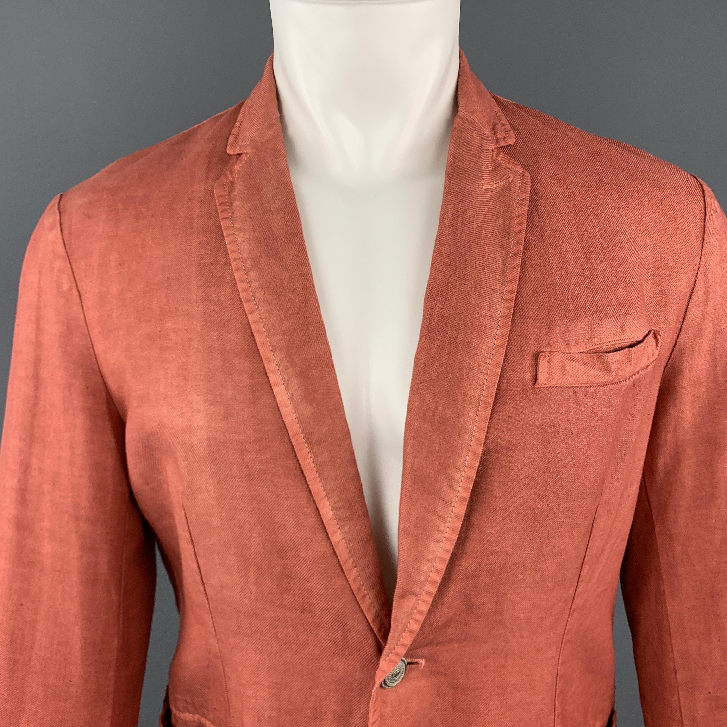 JUST CAVALLI by ROBERTO CAVALLI
sport coat comes in washed brick red cotton linen blend textured twill with a notch lapel, single breasted, two button front, and silver tone metal buttons. Made in Italy.Excellent Pre-Owned Condition. 

Marked:   IT