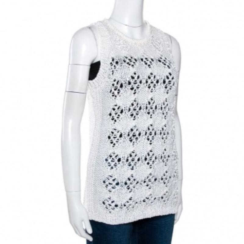 This lovely Just Cavalli top is great for the summers. Crafted from pure cotton, this sleeveless creation features open crochet knit and a white hue. It has a simple round neckline, good fit and effortless style. Pair with a host of bottoms and you