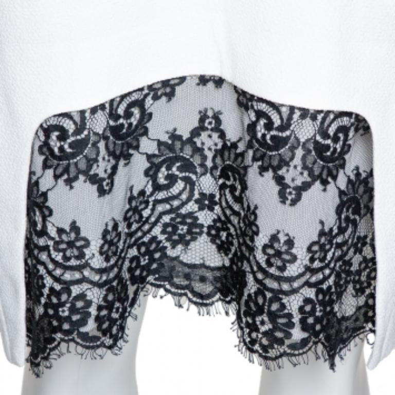 This dress is an example of Just Cavalli's unique aesthetics put together with brilliant tailoring. The shift dress has a white shade along with a sleeveless style and a lace trim at the hem. It is bound to look great with matching pumps.