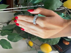 Just Under 10 Carat Oval Cut Diamond Eternity Band Set In Platinum.