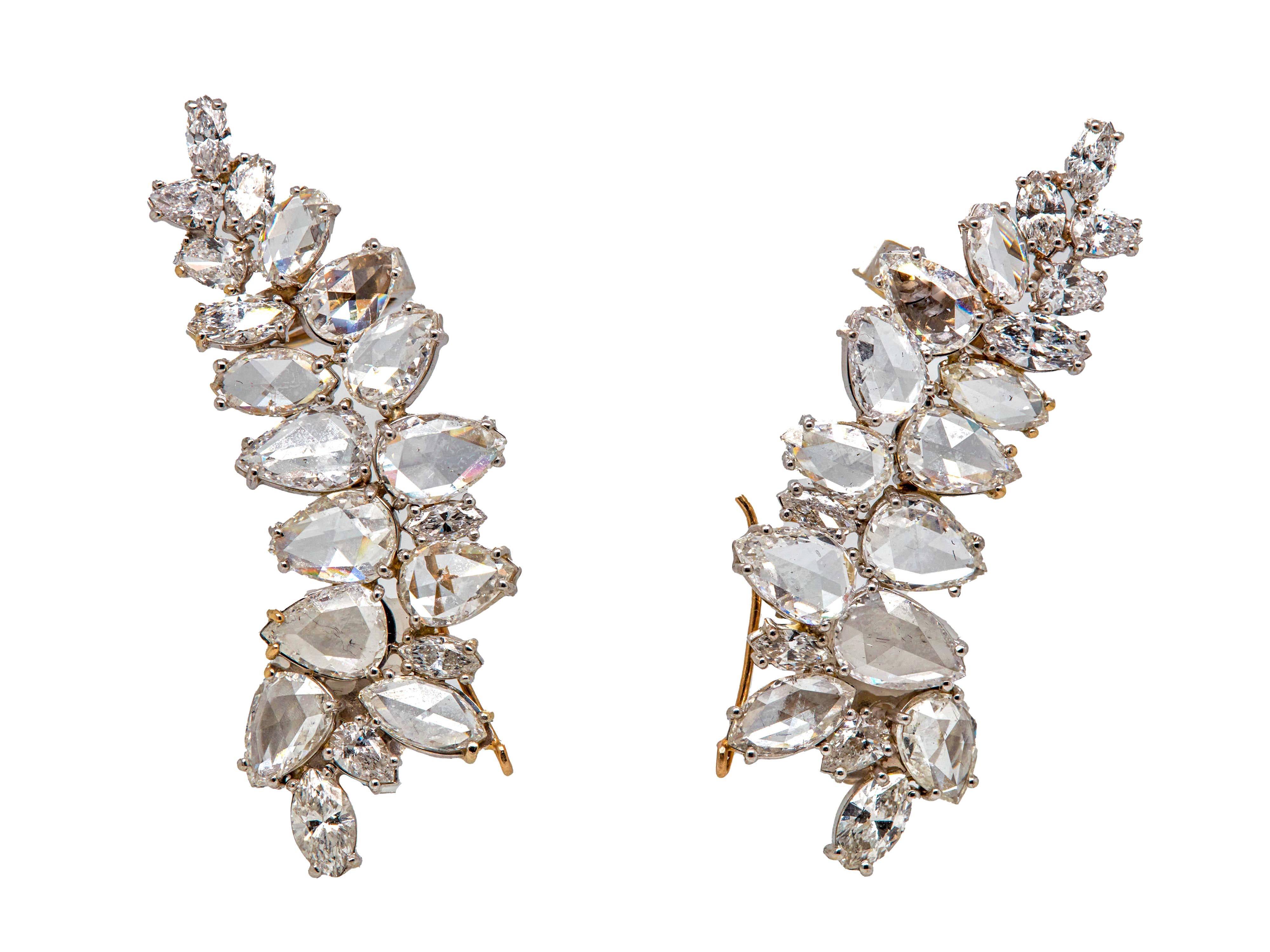 Absolutely gorgeous noteworthy pair of on-the-ear clips Just under 20 carat Cluster White Diamond Earrings. 
Set with 18 Marquis shaped diamonds weighing a total of approximately 6.05 carats and 22 Pear-shaped white diamonds weighing a total of