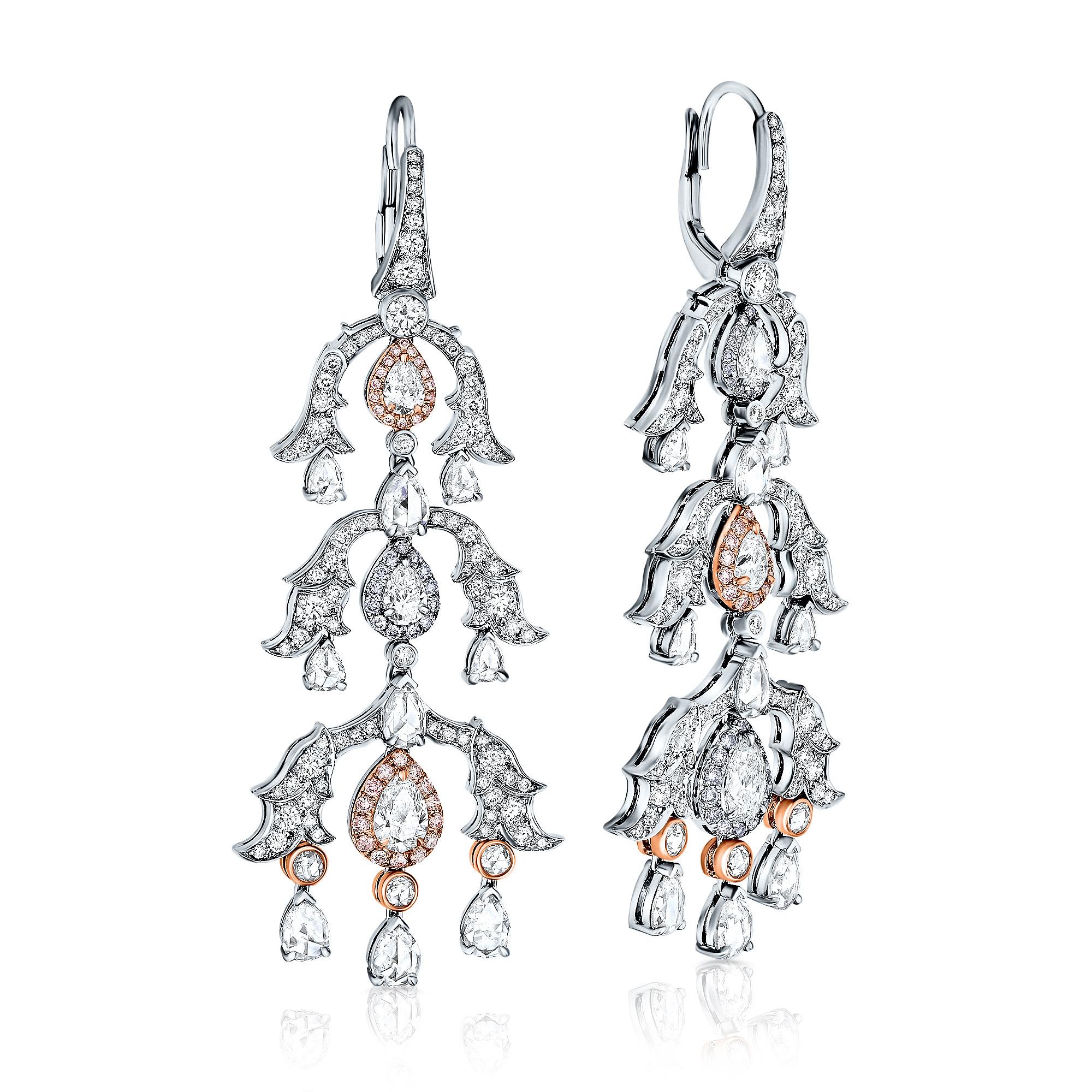 Introducing our stunning matched pair of White and Pink Diamond chandelier Drop Earrings, just under 7 carats and set in 18K white and rose gold.

These earrings are truly perfect for any occasion. They showcase 24 pear-shaped white diamonds,