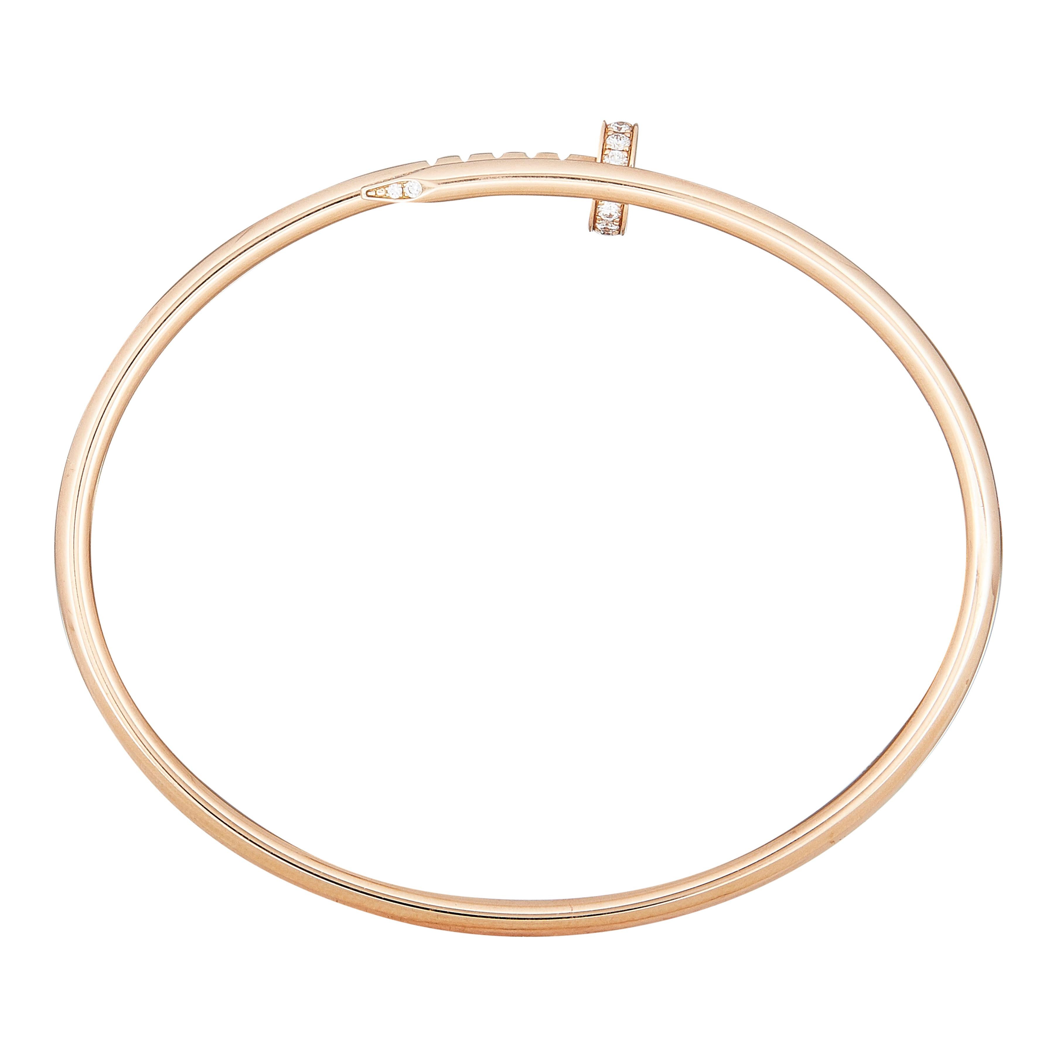 The bracelet:
A Cartier Juste Un Clou bracelet in eighteen karat rose gold with round brilliant cut diamond. The small model is flexible, designed to be slipped on and off the wrist. This particular piece is available in a size 16. 
The bracelet is