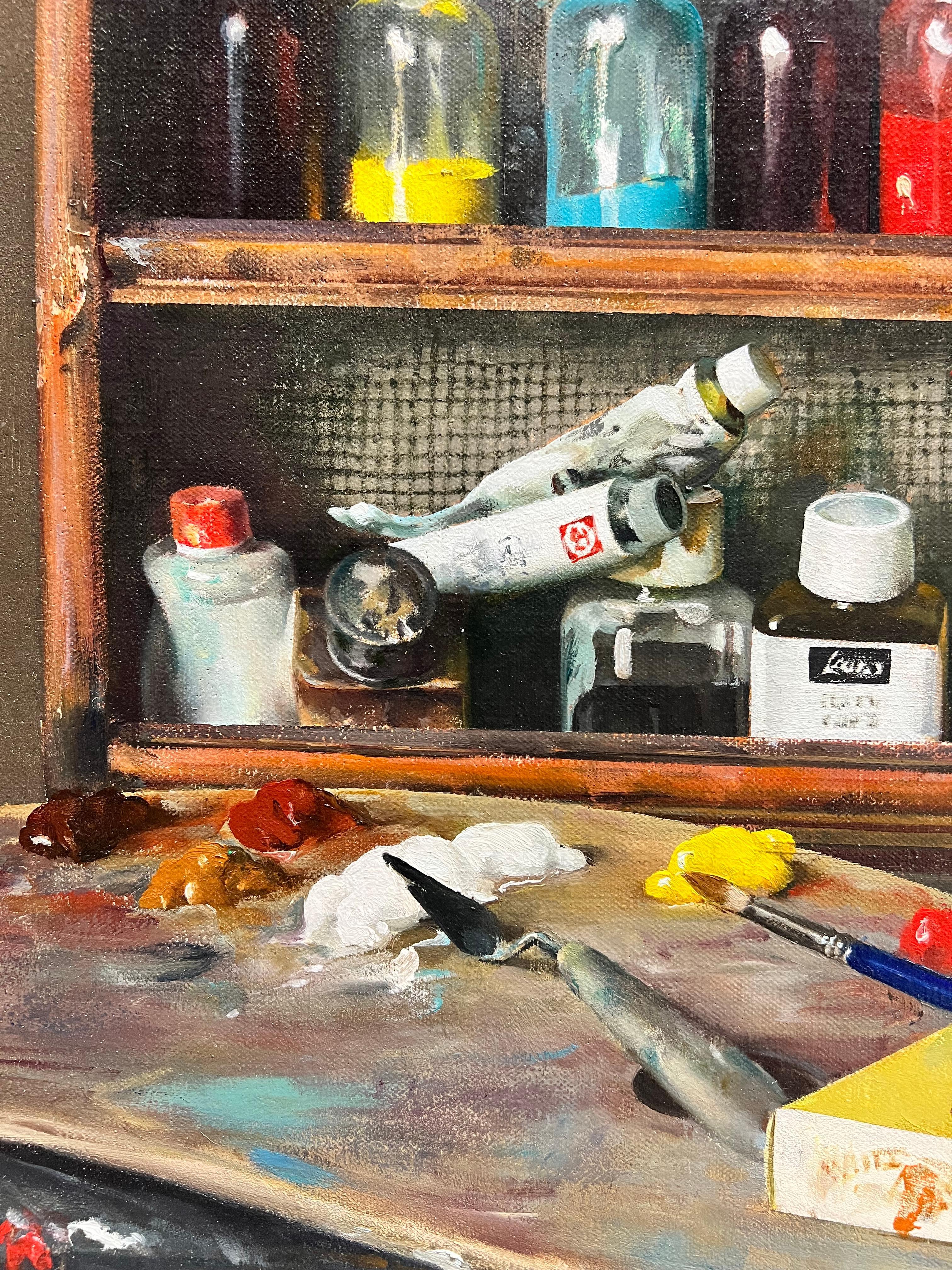 This painting beautifully captures a realistic view of an artist's studio.  The boxes covered in oil paint fingerprints, the small dent in the wall, the palette, tubes of paint scatter throughout- all come together to show the beauty in the mundane