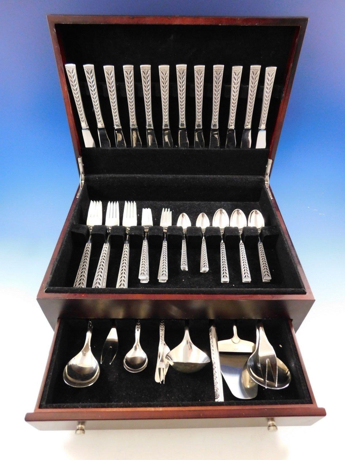 Beautiful Juvel by Nils Hansen sterling silver flatware set featuring a stunningly pierced handle, 70 pieces. This set includes:

12 dinner knives, 8
