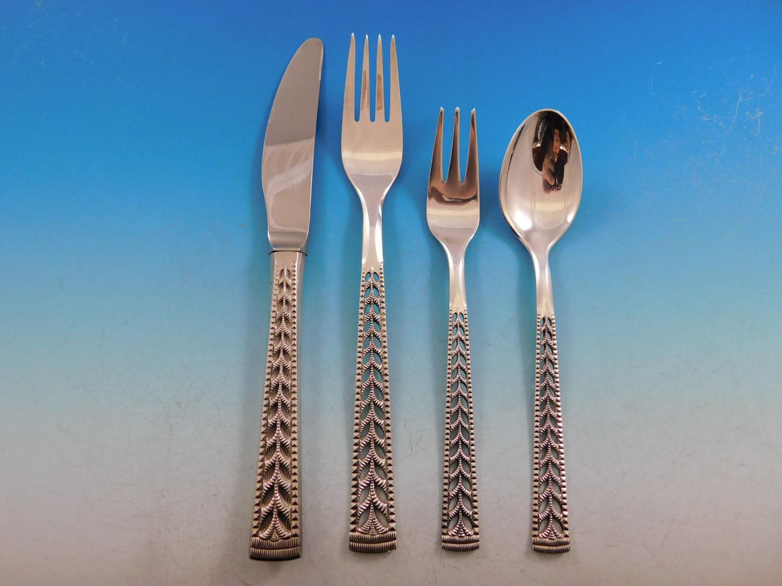 Juvel by Nils Hansen Norway Norwegian 830 silver Flatware set with unique pierced handle, 48 pieces. This set includes:

8 Knives, 8