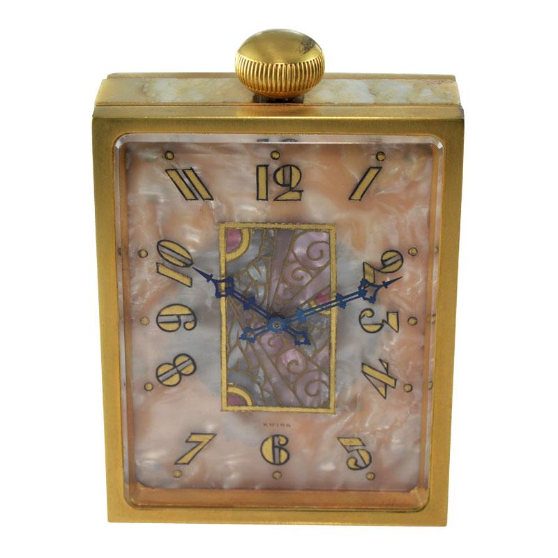 FACTORY / HOUSE: Juvenia Watch Company 
STYLE / REFERENCE: Art Deco / Table Clock 
METAL / MATERIAL: Gilded Bronze
CIRCA / YEAR: 1930's
DIMENSIONS / SIZE:  2.5 Inches X 3 1/8 or 6cm X 8cm
MOVEMENT / CALIBER: Manual Winding / 15 Jewels 
DIAL / HANDS: