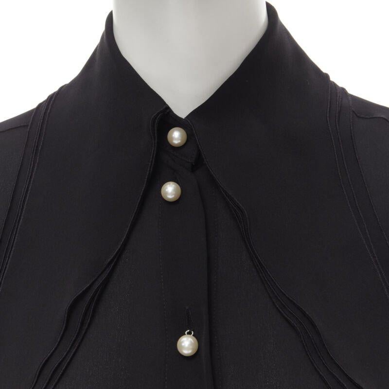 JW ANDERSON black silk pearl button layered collar blouse shirt UK8 S
Reference: MELK/A00127
Brand: JW Anderson
Designer: JW Anderson
Material: Silk
Color: Black
Pattern: Solid
Closure: Button
Extra Details: Faux pearl buttons. Layered long collar.