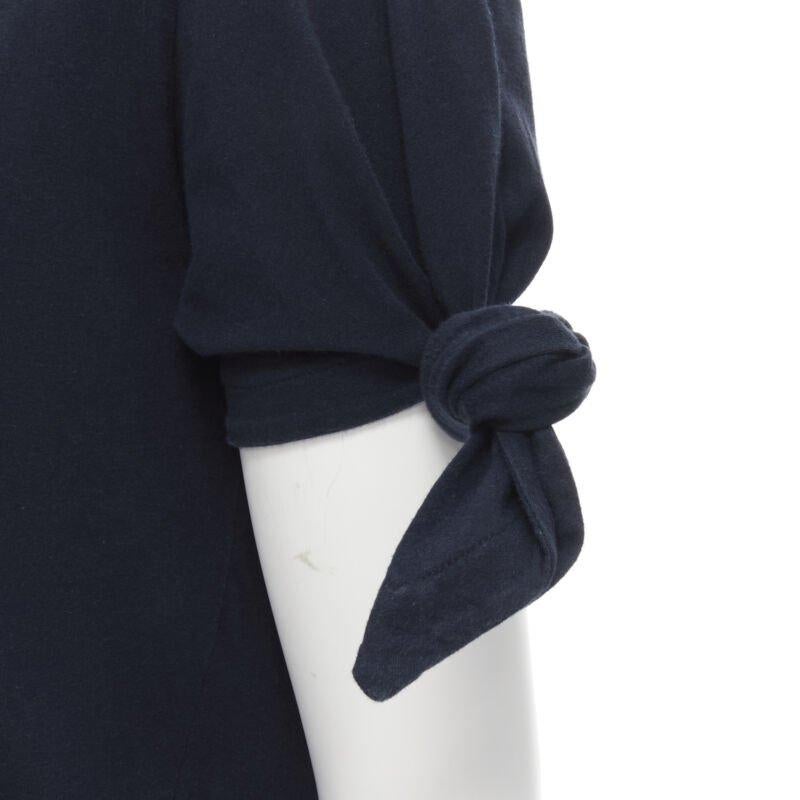 JW Anderson JWA logo embroidered navy blue cotton tie sleeve T-shirt S
Reference: INYG/A00002
Brand: JW Anderson
Material: Cotton
Color: Navy
Pattern: Solid
Extra Details: Self tie short sleeve.
Estimated Retail Price: USD 200
Made in: