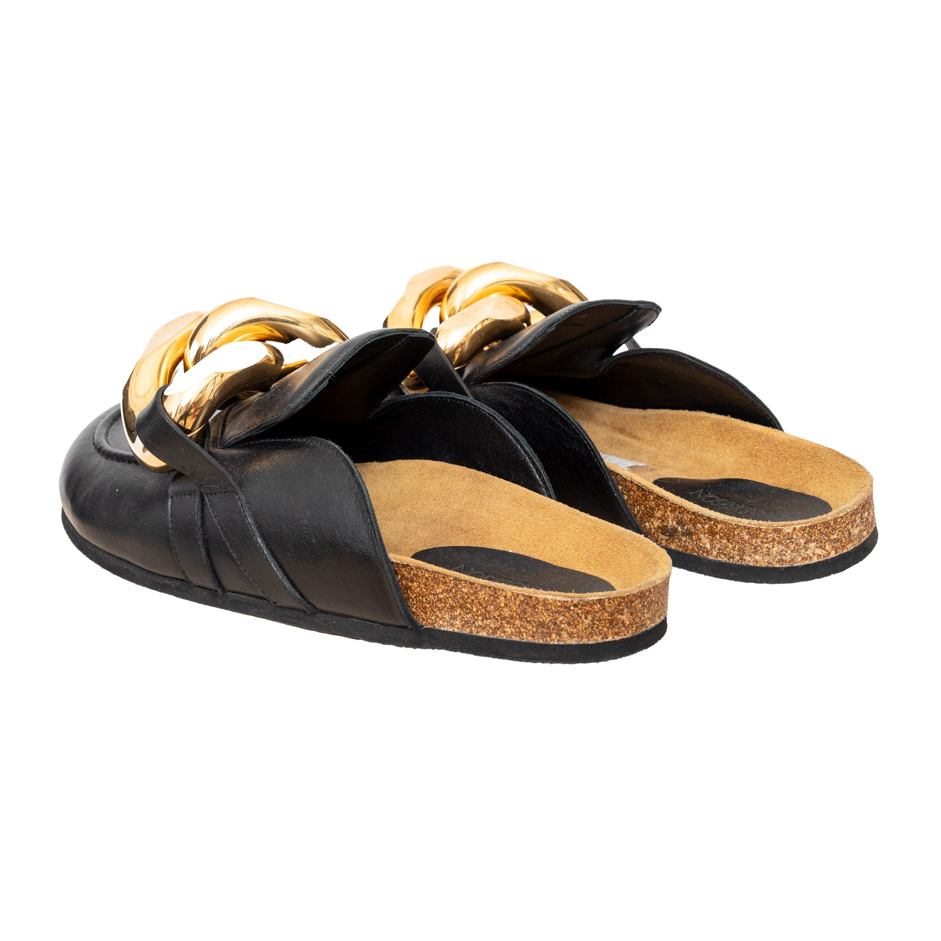 Elevate your shoe game with the JW Anderson Leather Mules. Crafted from premium leather, these loafer mules feature gold-tone chain link detailing and a rounded toe. The cork footbeds provide comfort and support for all-day wear. 
 Retail Price: