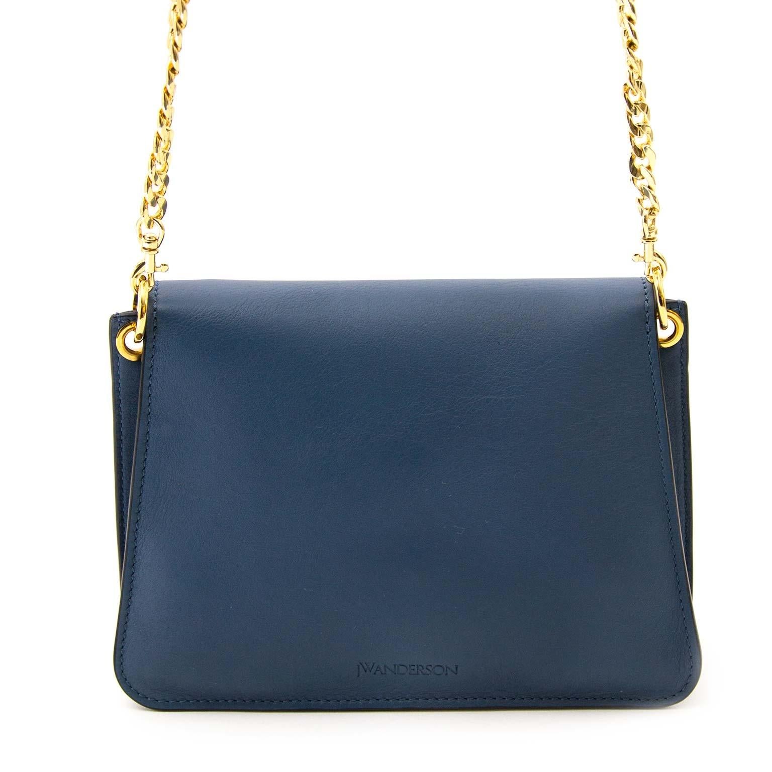 Brand New!

JW Anderson Mini Pierce Bag Storm Blue

This gorgeous crossbody bag is made from beautiful blue calfskin leather and features all the iconic JW Anderson Pierce bag trademarks. The bag has gold-tone metal hardware and a signature