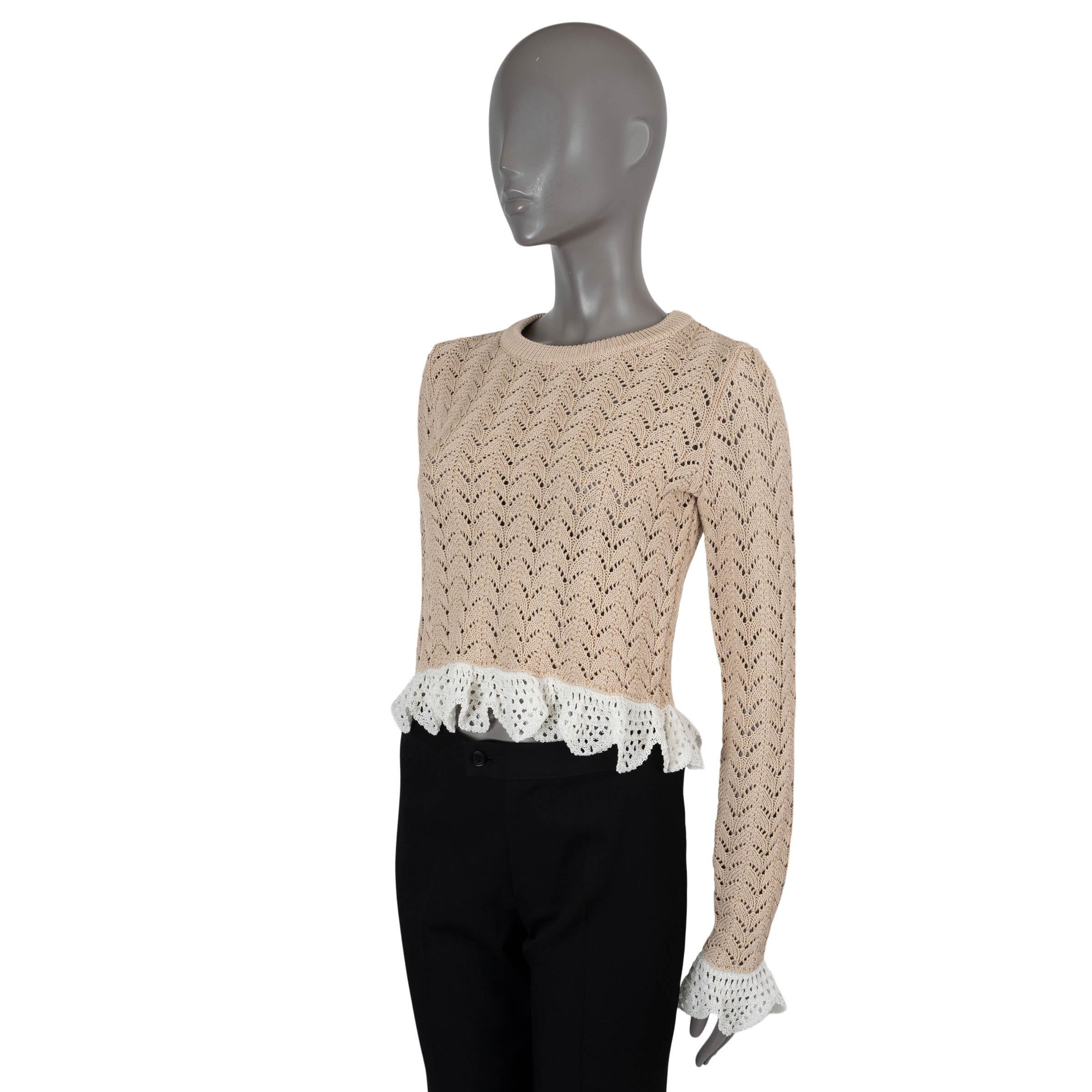 100% authentic J.W.Anderson cropped crochet sweater in nude cotton (100%). Features a crewneck, pointel hem and fril cuffs in cream. Has been worn and is in excellent condition.

Measurements
Tag Size	XS
Size	XS
Shoulder Width	35cm (13.7in)
Bust