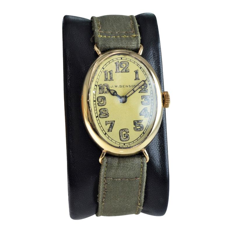 FACTORY / HOUSE:  J. W. Benson 
STYLE / REFERENCE: Art Deco / Oval
METAL / MATERIAL: 14Kt. Solid Yellow Gold
DIMENSIONS: Length 38mm X  Width 26mm
CIRCA / YEAR: 1918
MOVEMENT / CALIBER: Manual Winding /  15 Jewels 
DIAL / HANDS:  Silver Kiln Fired