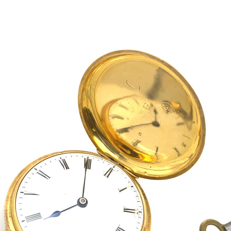 This J.W. Benson 18ct pocket watch with hand engraving and original key is a wonderful piece of jewellery. It has a stylish look with a classic design. The 18ct Gold case is decorated with hand engraving. The watch is a timeless piece.

Additional