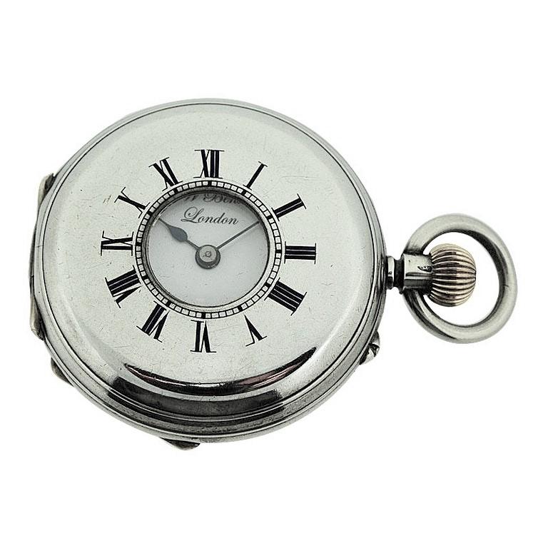 FACTORY / HOUSE: J.W.Benson London 
STYLE / REFERENCE: Half Hunters Case 
METAL / MATERIAL: Sterling Silver
CIRCA: 1890's 
DIMENSIONS: Diameter 39mm
MOVEMENT / CALIBER: Manual Winding / 13 Jewels 
DIAL / HANDS: Original Kiln Fired Enamel with Roman