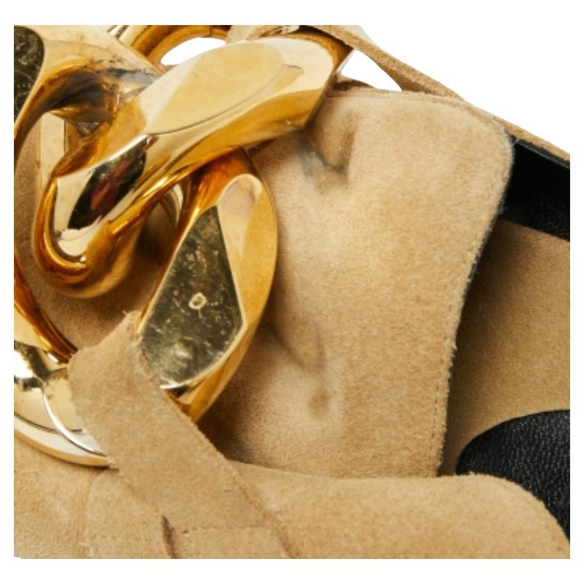 Walk stylishly in these slide sandals from J.W.Anderson. Designed using beige suede, these flat slides display a chain-link accent on the vamps. They are finished with gold-toned hardware for a classy effect. Match them with your summer dresses for