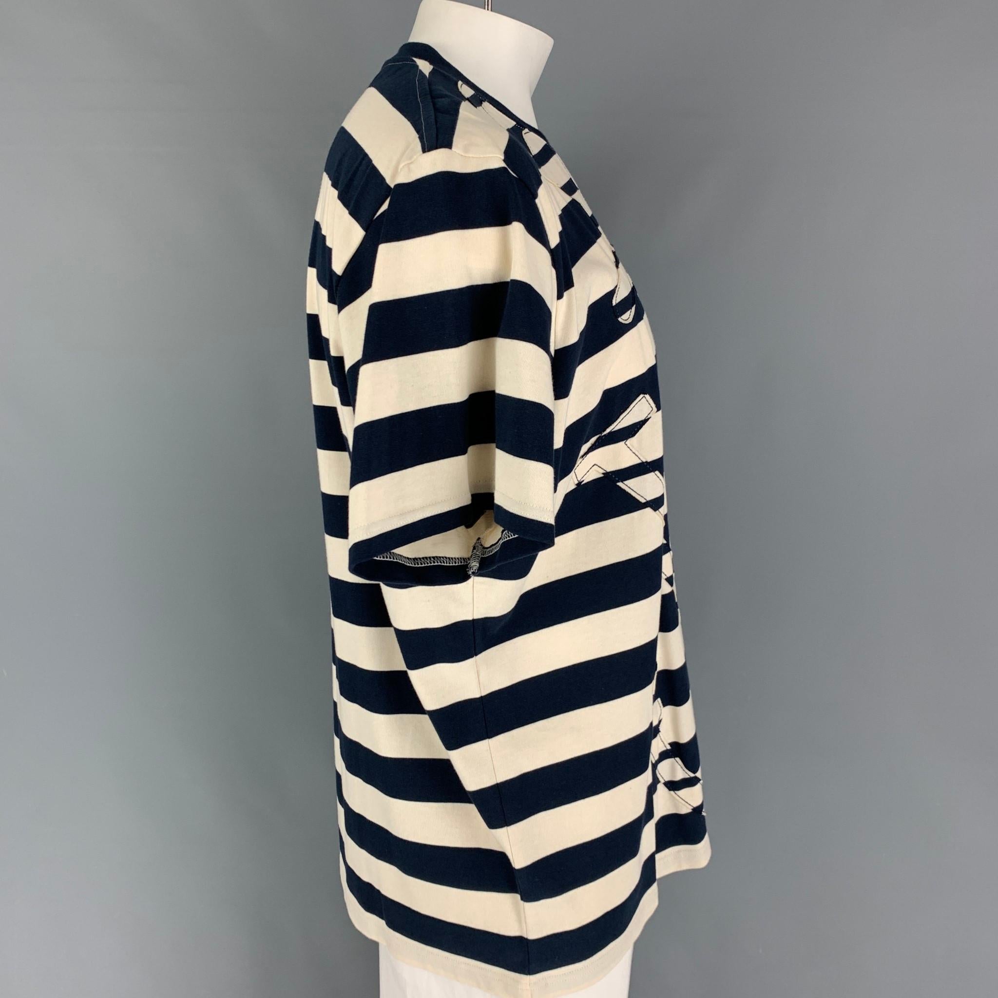 J.W. ANDERSON t-shirt comes in a navy & cream stripe cotton featuring a nautical style, anchor patch, and a crew-neck. 
 

Very Good Pre-Owned Condition.
Marked: L

Measurements:

Shoulder: 21 in.
Chest: 50 in.
Sleeve: 9.5 in.
Length: 29 in. 