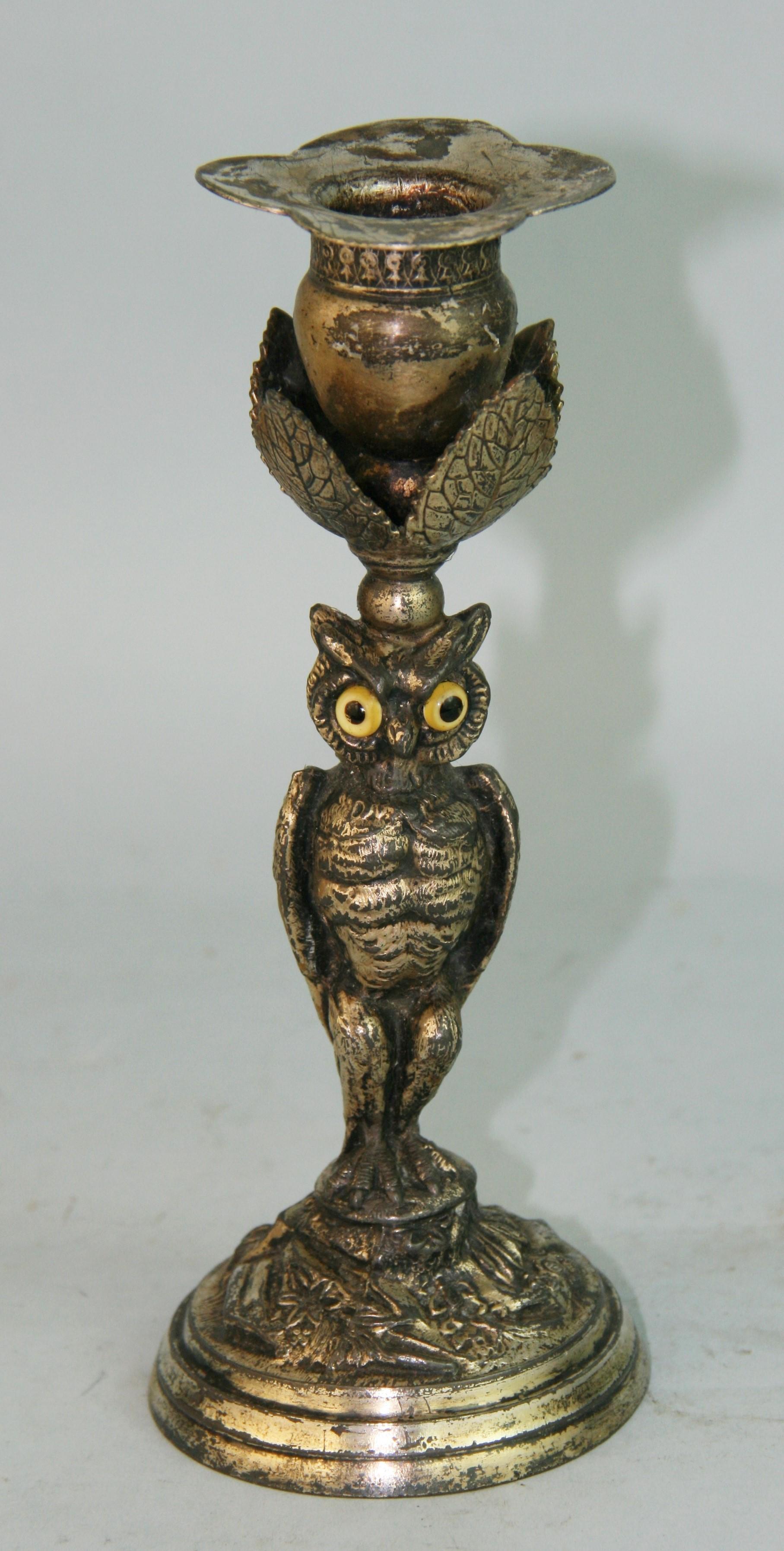 1200 Hand crafted silver plated miniature owl candle holder with glass eyes.
Manufactured in Boston by J.W.Tufts 1875 to 1915.