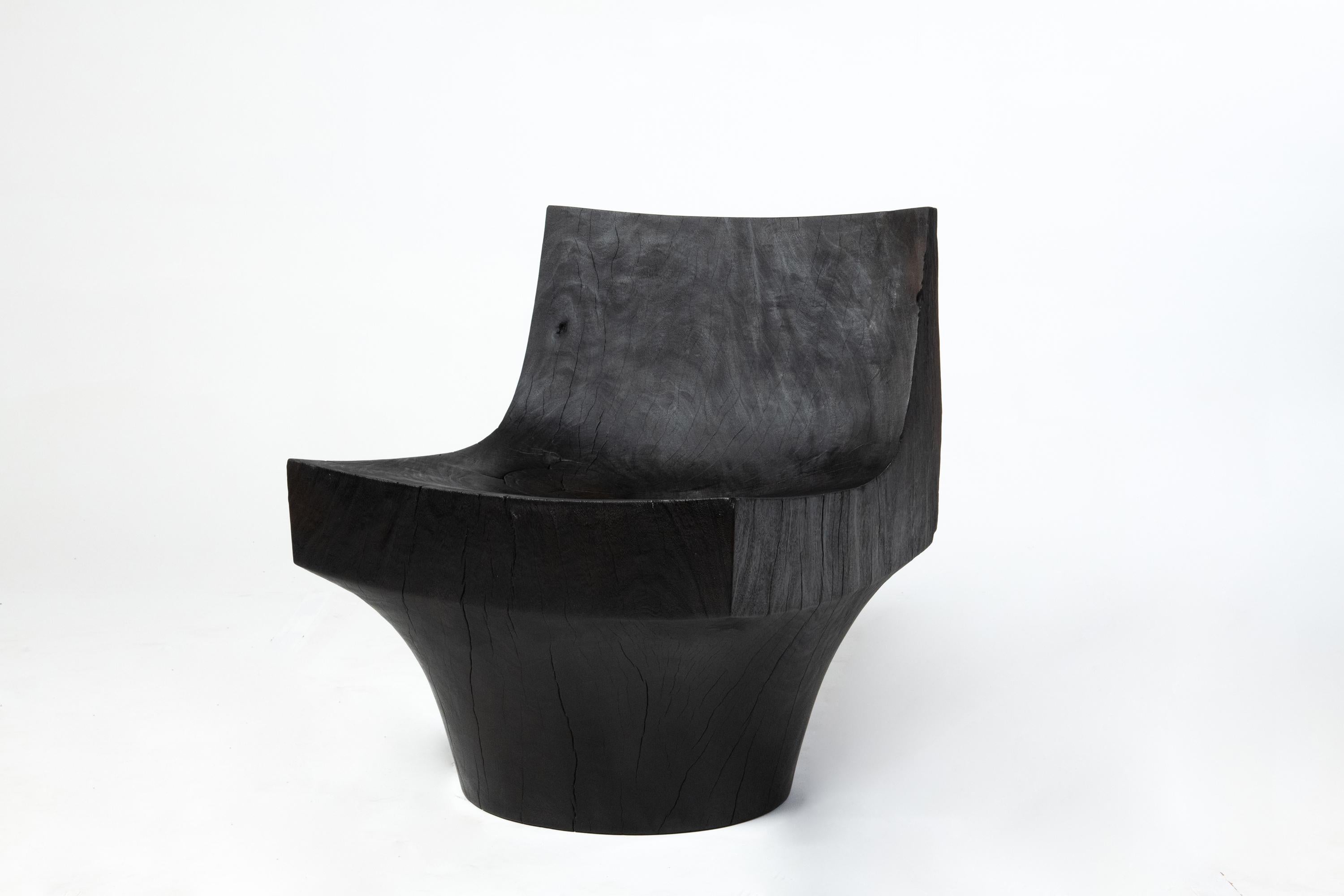 Reynold Rodriguez
K Chair, 2019
Charred hand-carved almendro wood
29 x 24 x 24 in
Edition of 8

Made of charred Almendro wood salvaged from trees that fell during the devastation of Hurricane Maria in Puerto Rico, the K chair is carved by hand from