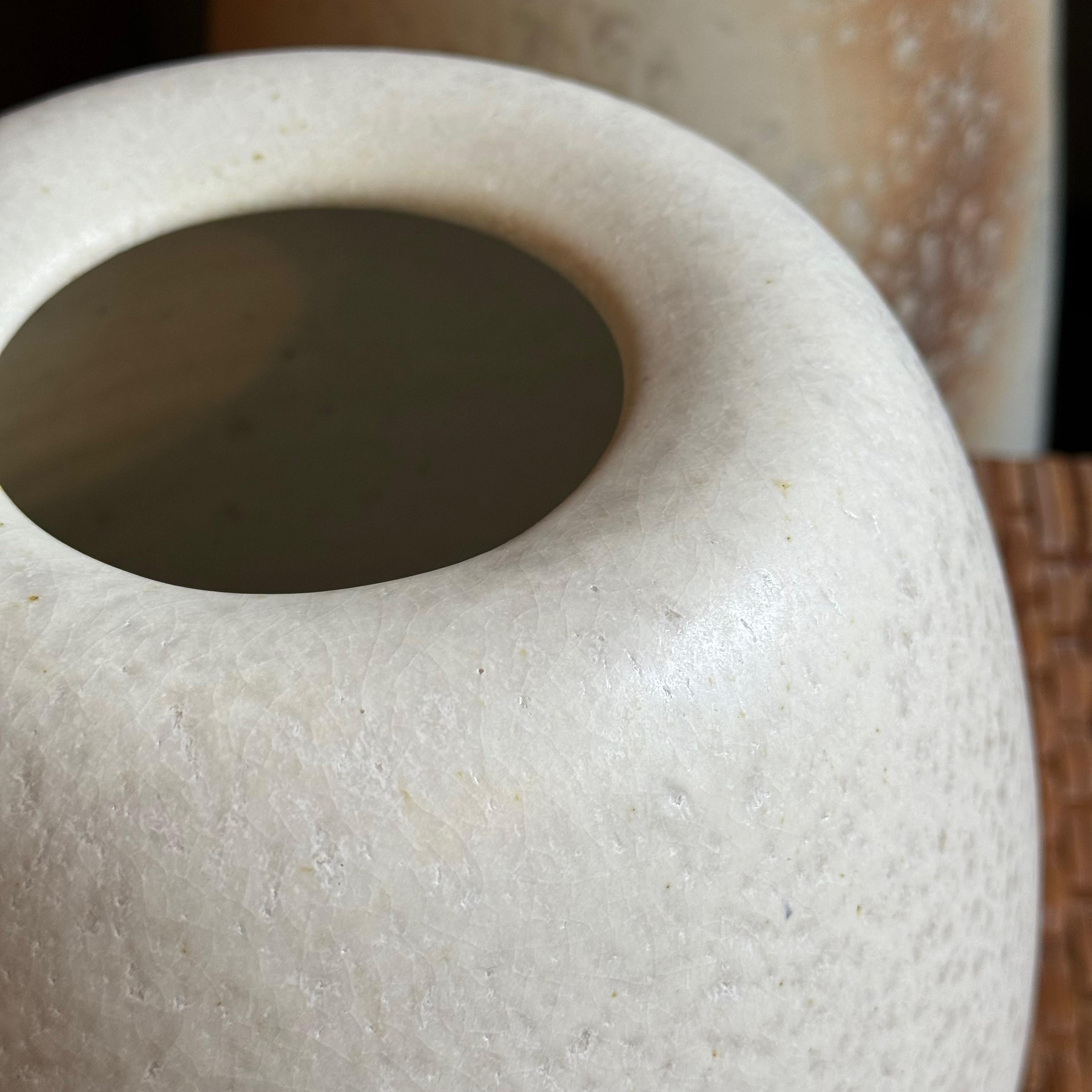 A small, ovoid vase made and designed in Denmark by K H Würtz. 

This beautifully proportioned art piece from the Danish studio of K H Würtz is glazed in a prismatic ivory. The opening of the vessel curves inwards creating a gentle shadow in the