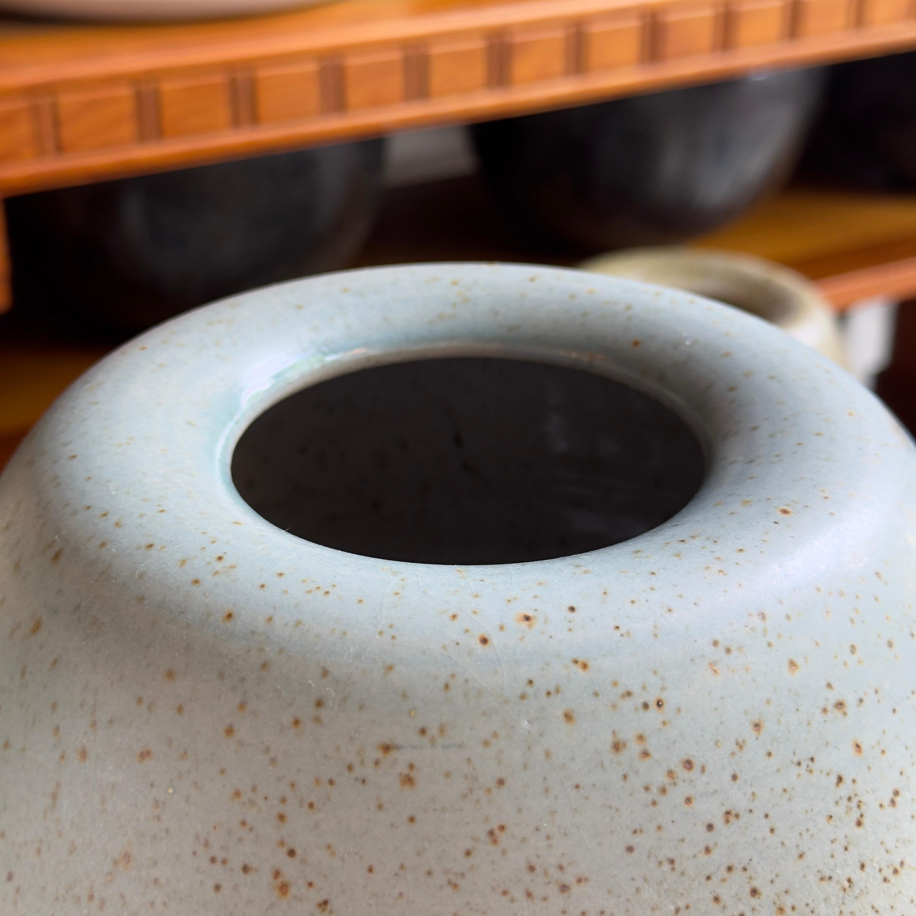 A speckled, ovoid vase made and designed in Denmark by K H Würtz. This ovoid shaped vessel is glazed in a pale turquoise. 

The vessel is evenly coated with a constellation of brown flecks, evoking the speckled appearance of certain birds eggs.