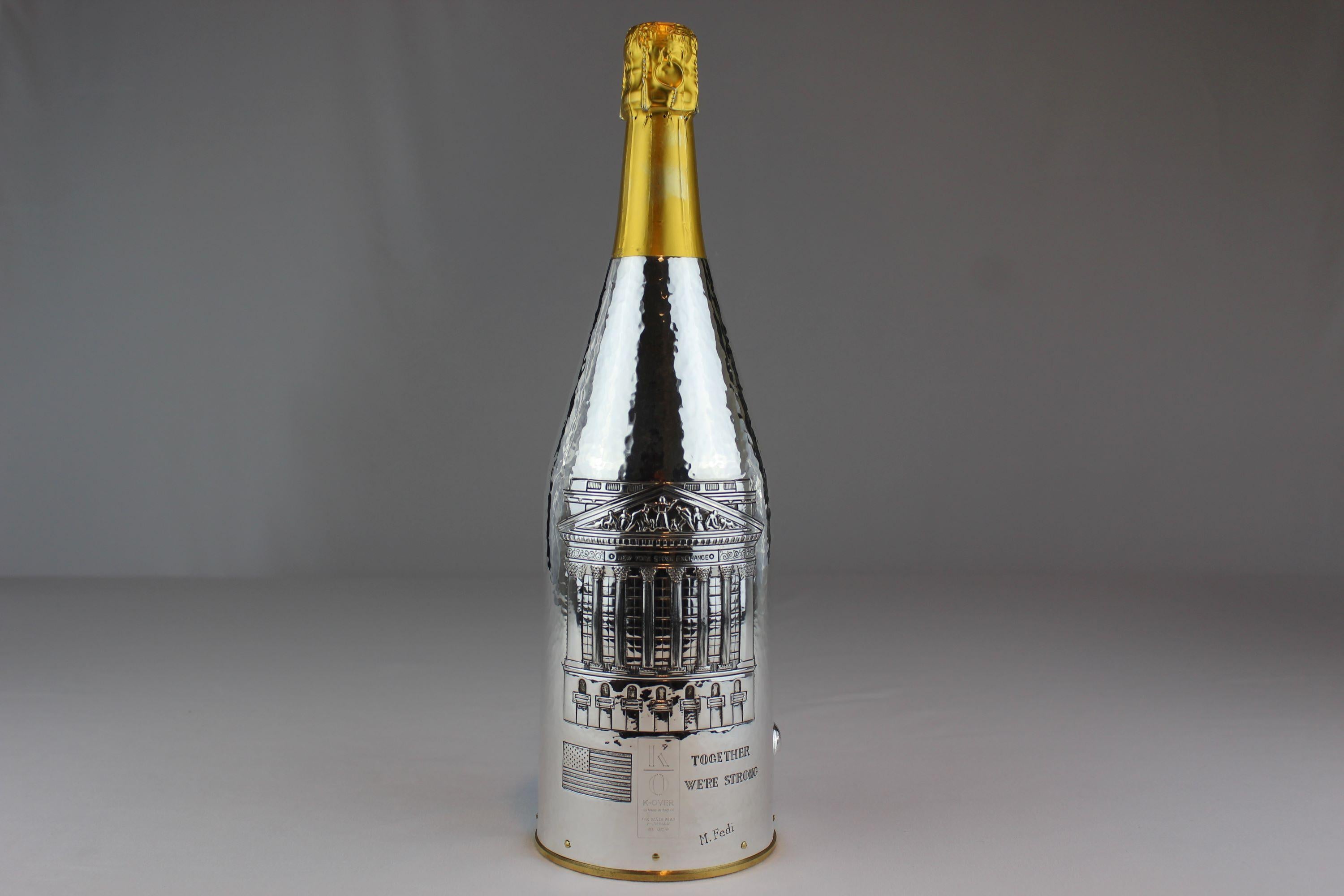 WALL STREET :
Our K-OVERs, are alternatives to the champagne bucket and the more common glacette.  The precious metal that holds the bottle is coated internally with a thermal fabric that maintains the temperature of your champagne for about 2