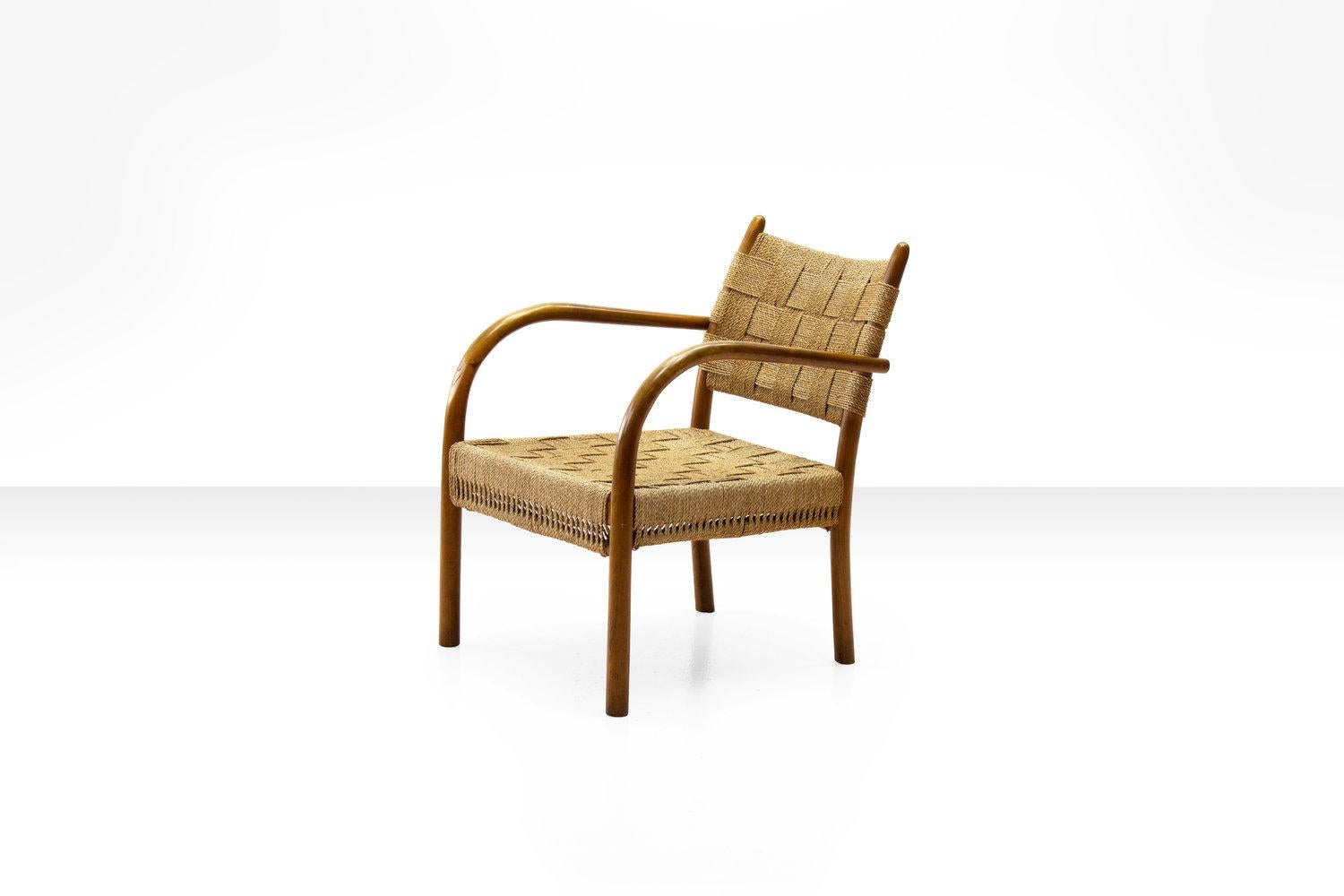 Beech armchair with woven papercord seat and back by K. Scröder, Denmark 1938. Model 1459. Manufactured by Fritz Hansen, 1930s-1940s.

Until recently this rare and sought after armchair was commonly attributed to Frits Schlegel. However a closer