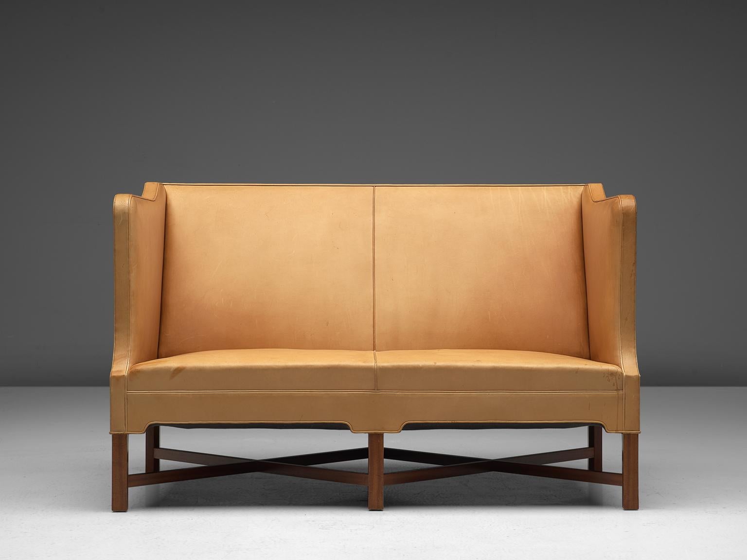 Kaare Klint for Rud Rasmussen two-seat settee model 4118, natural colored niger leather and mahogany legs, Denmark, design 1929, manufactured late 90s.

Classic and elegant Scandinavian custom made two-seat settee by Kaare Klint for manufacturer Rud