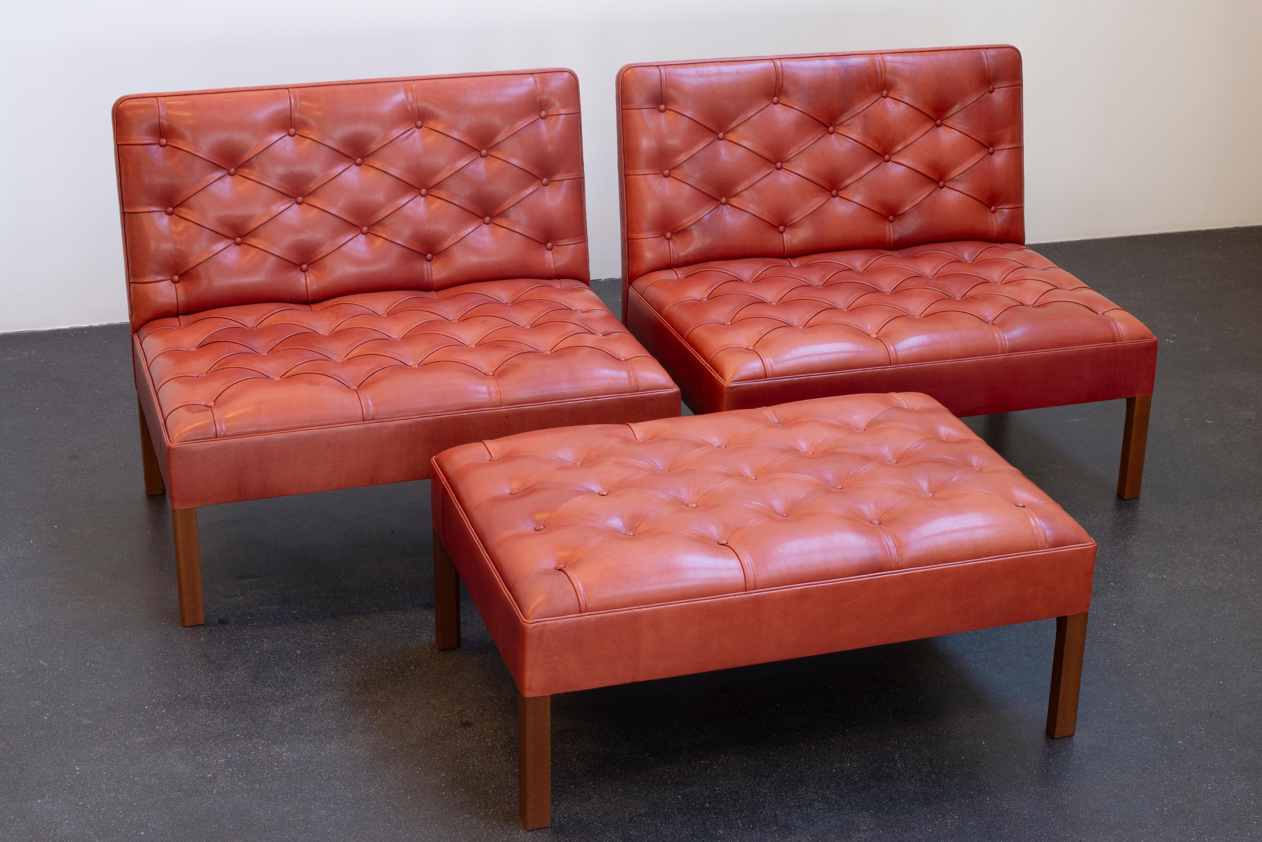 Kaare Klint Sectional sofa/stools in mahogany and leather.  Executed by cabinetmakers Rud. Rasmussen, Denmark