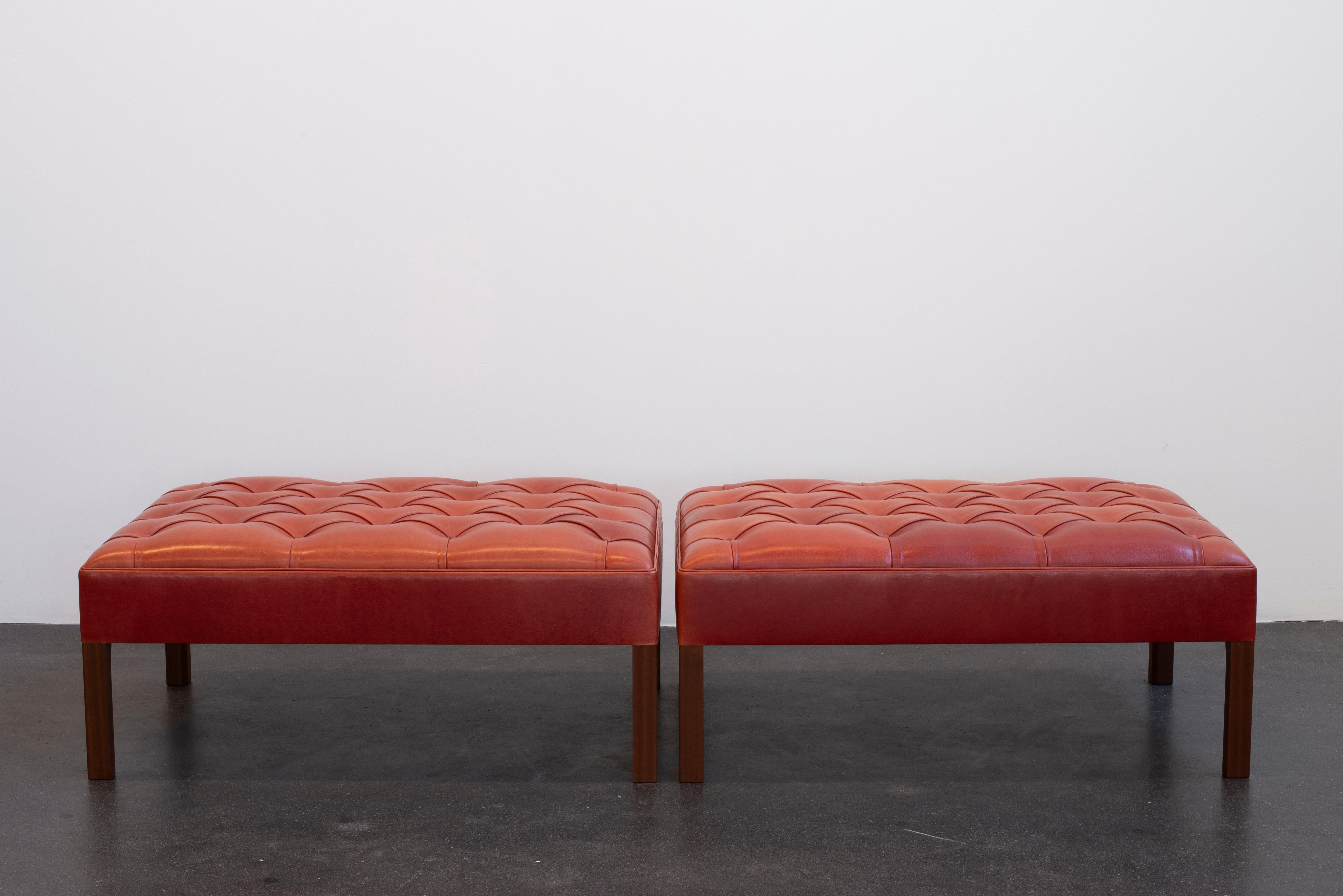 Kaare Klint Sectional sofa/stools in mahogany and leather.  Executed by cabinetmakers Rud. Rasmussen, Denmark