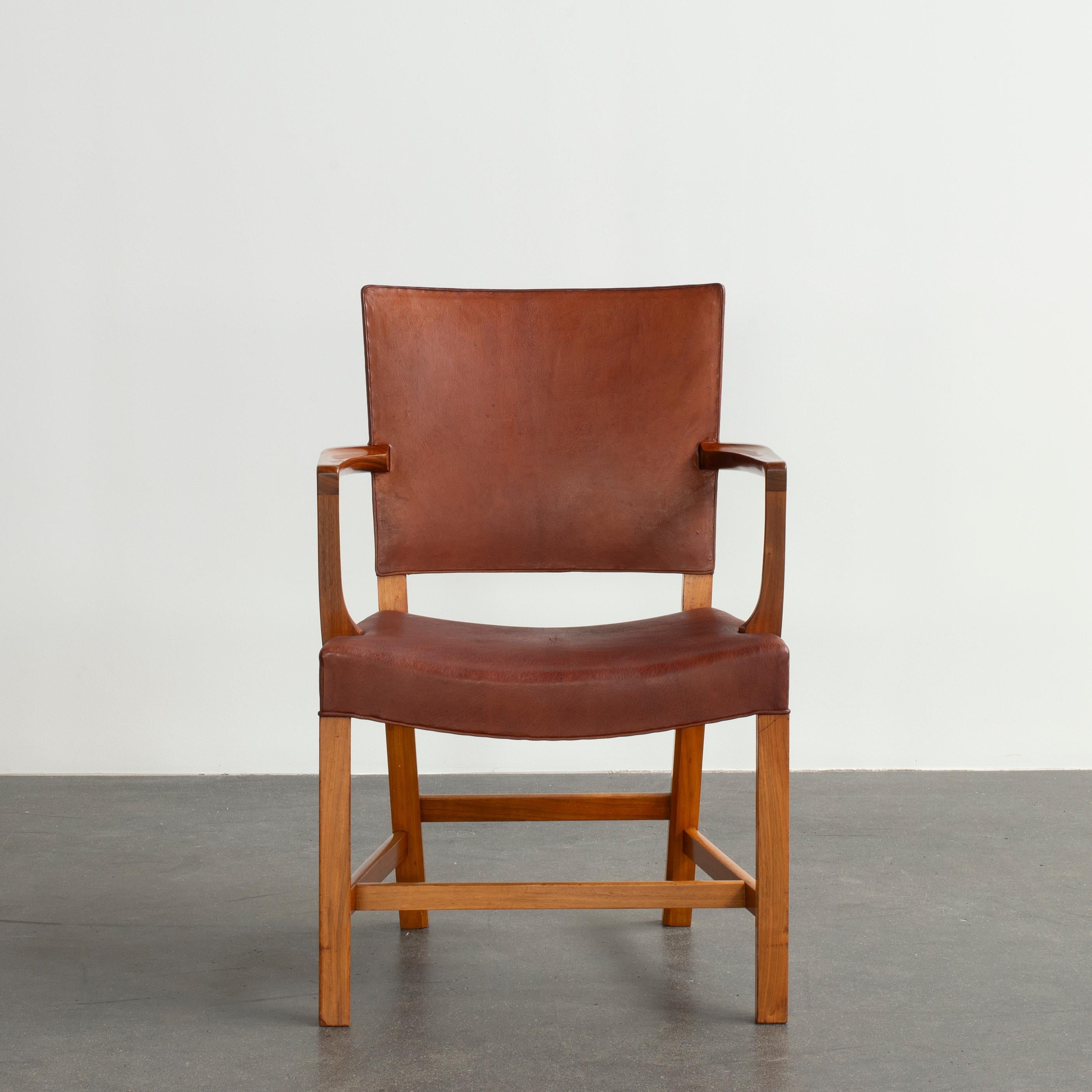 Kaare Klint 'red chair' in walnut. Upholstered with Niger leather. Executed by Rud. Rasmussen, 1934-1938.

Underside with manufacturer's paper label RUD. RASMUSSENS/SNEDKERIER/45 NØRREBROGAD/KØBENHAVN, pencilled serial number and architect's