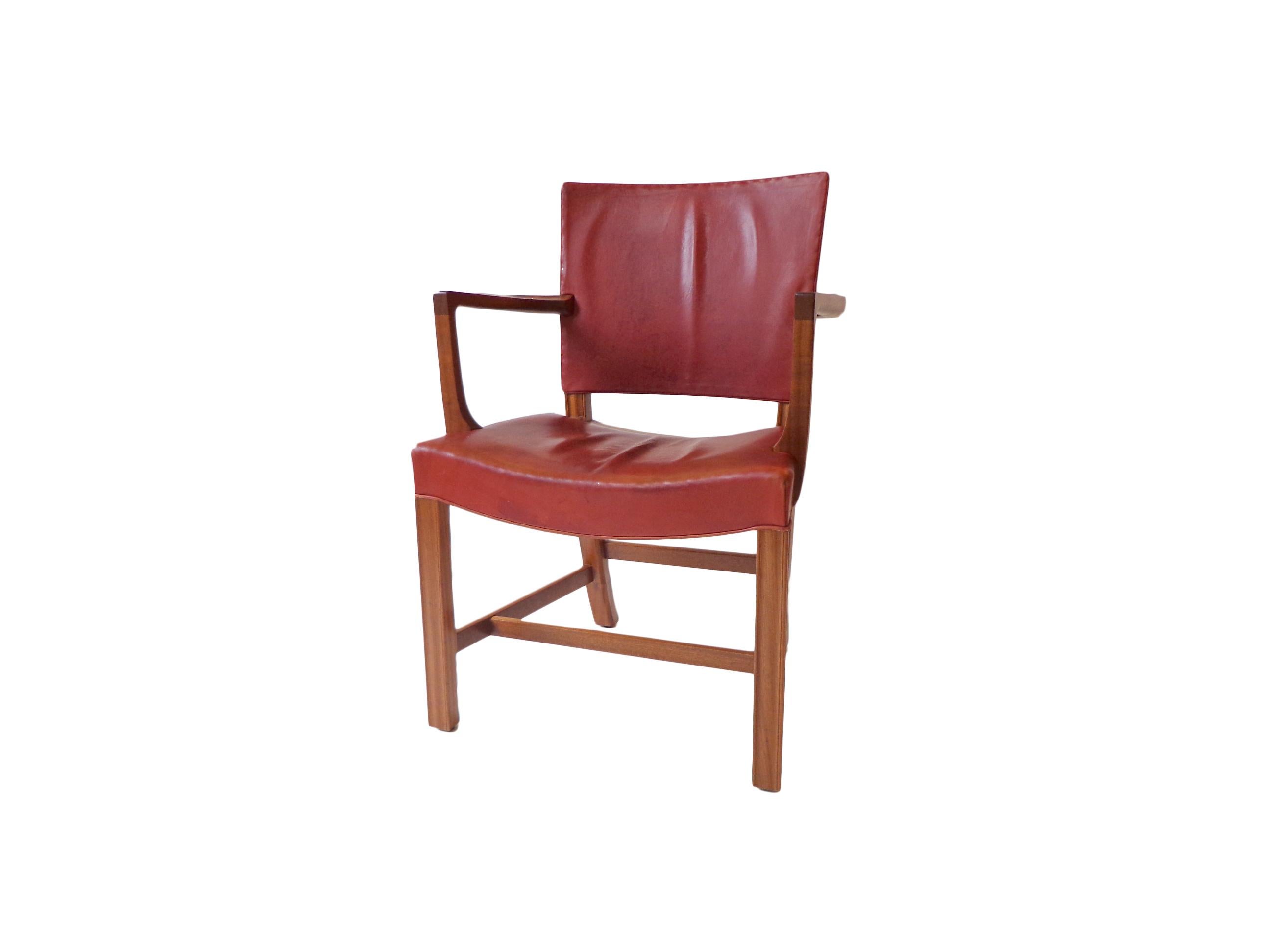 Armchair model 3758 A in original red Indian leather and mahogany base. Model designed in 1927 for the Danish Museum of Decorative Art, produced by Rud Rasmussen in the 1940s. Signed with manufacturer’s label to underside: (Rud. Rasmussens