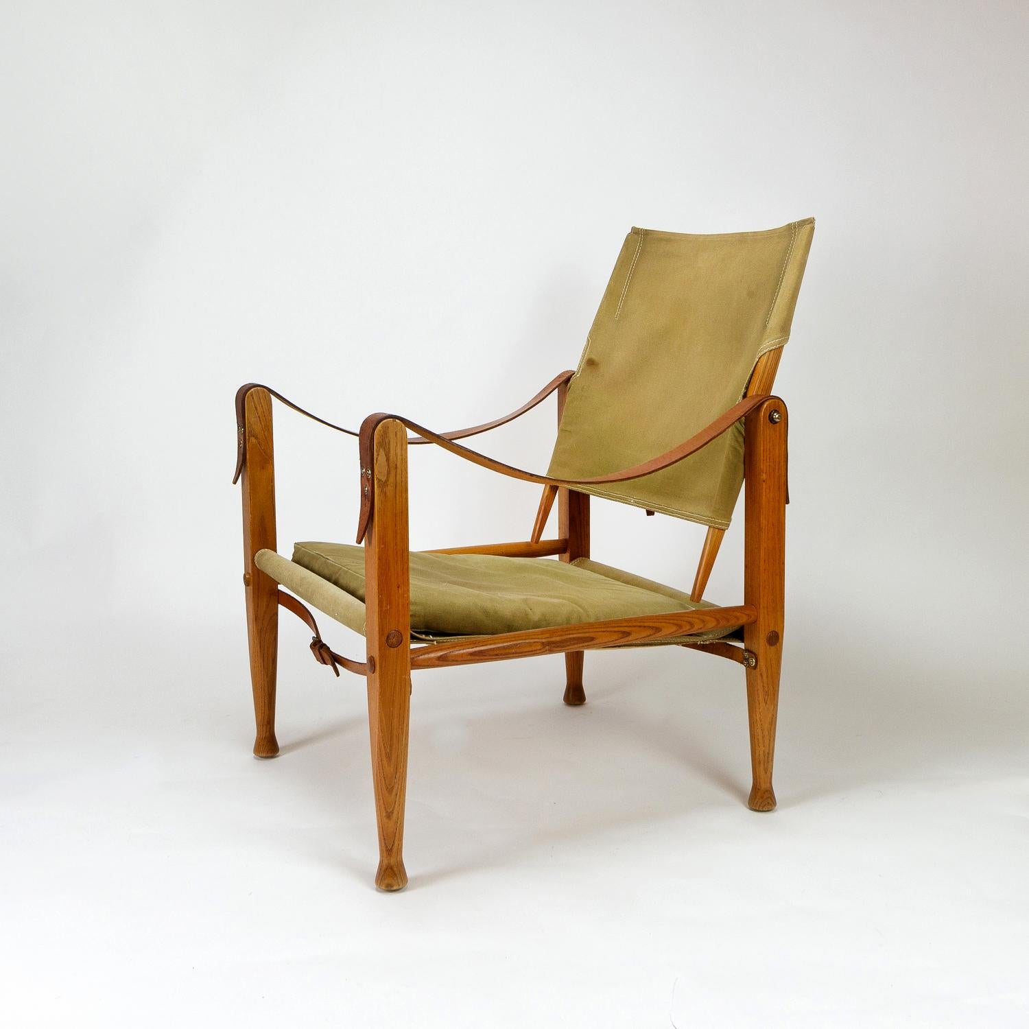 Safari chair in ash with original khaki canvas seat, cushion and back designed by Kaare Klint, the father of Danish functionalism. In great original condition. Stitching all good and lovely patina on the frame. Designed in 1933 and made by Rud