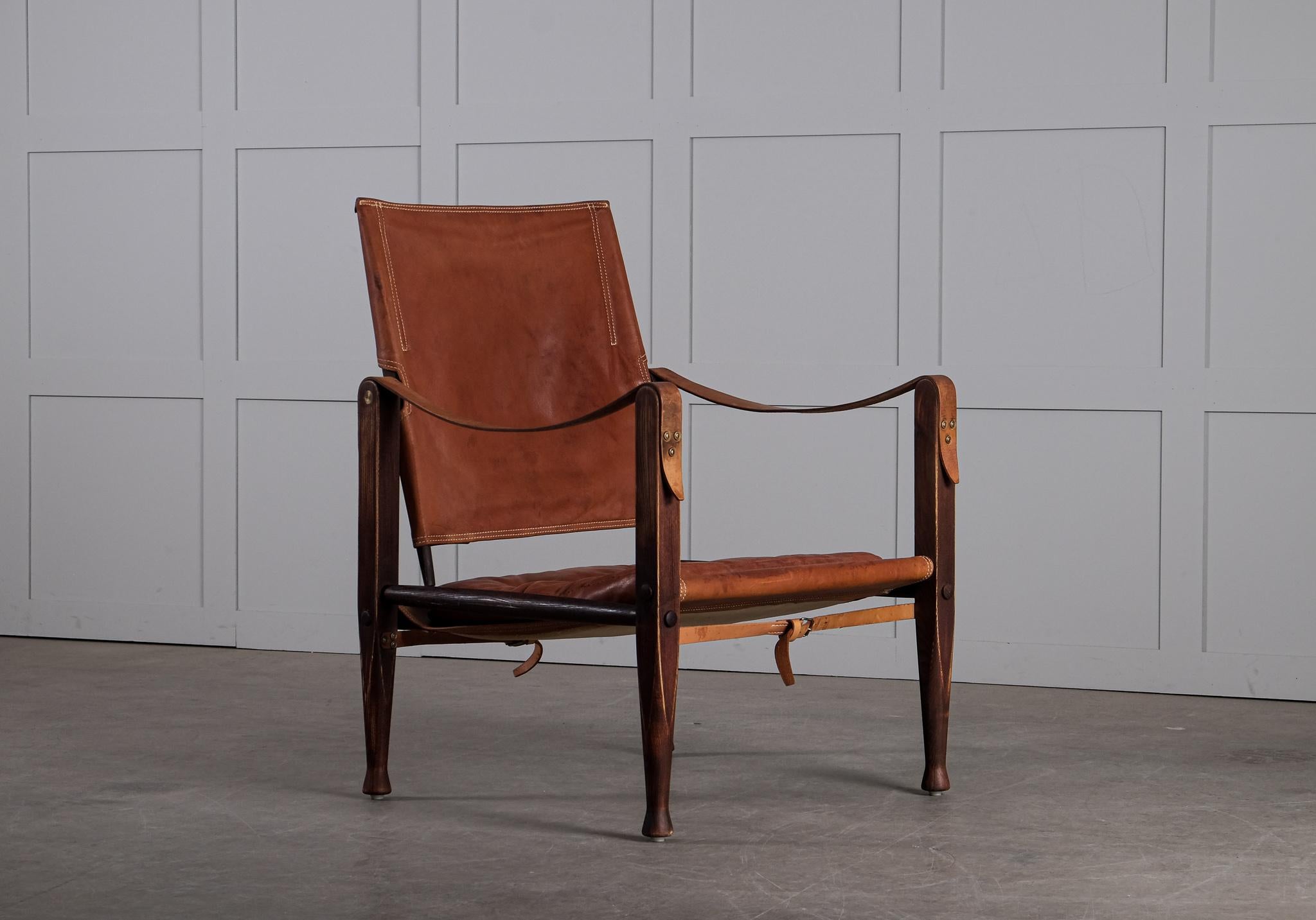 Safari chair with patinated cognac brown leather. Designed by Kaare Klint in 1933, produced by Rud. Rasmussen, Denmark.
   