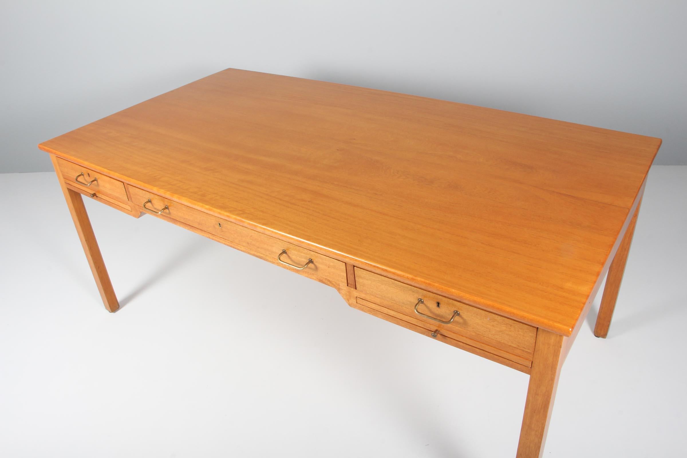Kaare Klint desk made of solid cuban mahogany. 

Drawers and writing trays with brass details.

Made and marked by Rud Rasmussen.
