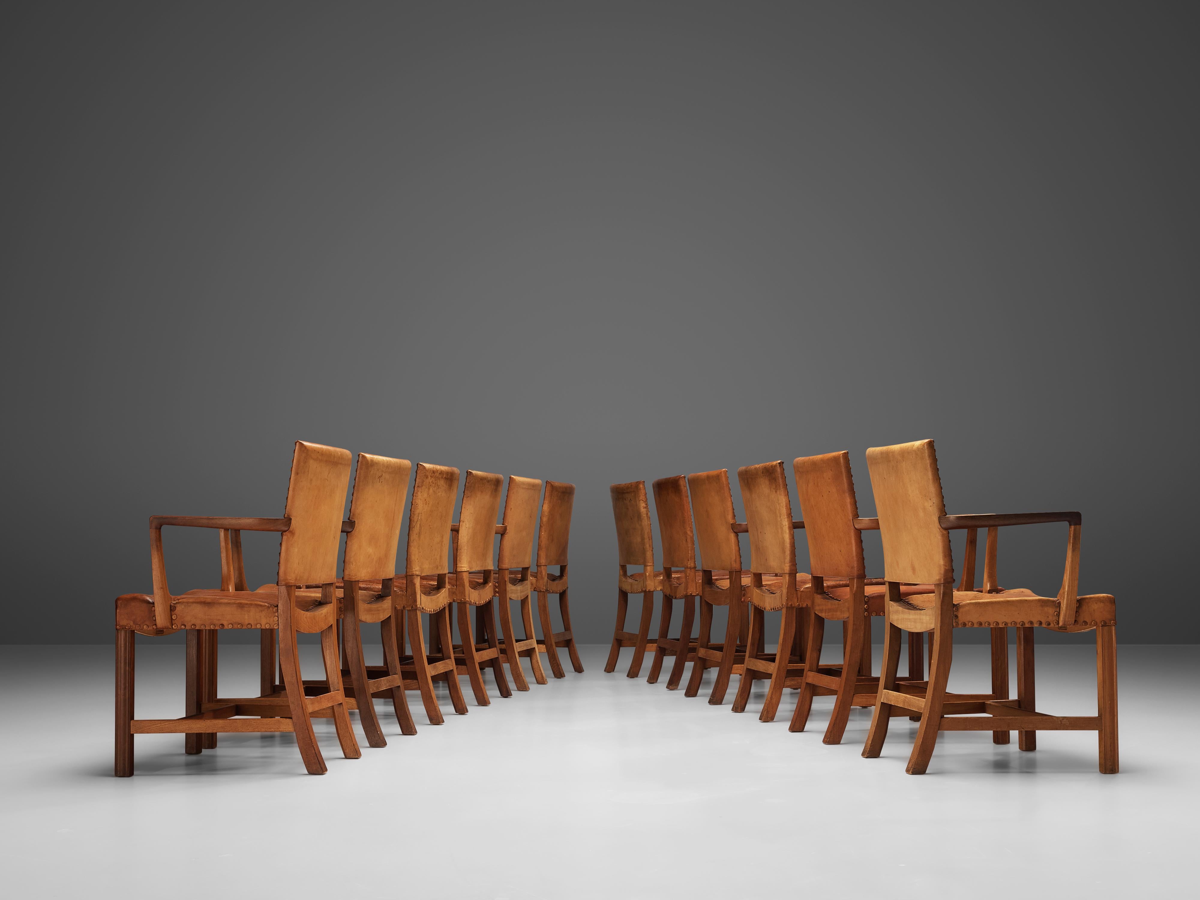 Kaare Klint for Rud Rasmussen, set of twelve dining chairs 'The Red Chair', model 3758, oak, original patinated Niger leather, brass nails, Denmark, designed 1930

Set of twelve dining chairs with and without armrests designed by Kaare Klint in 1930