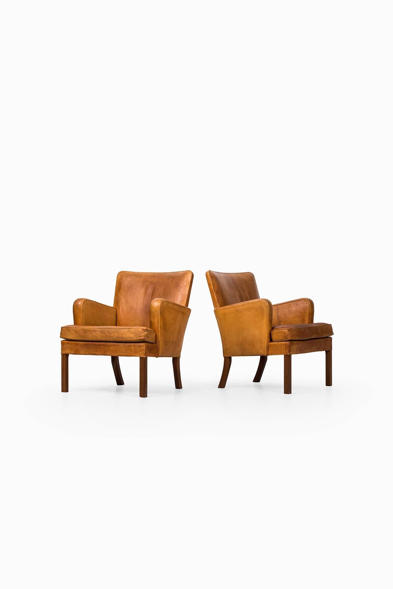 Rare pair of easy chairs model 5313 designed by Kaare Klint. Produced by Rud. Rasmussen Cabinetmakers in Denmark.